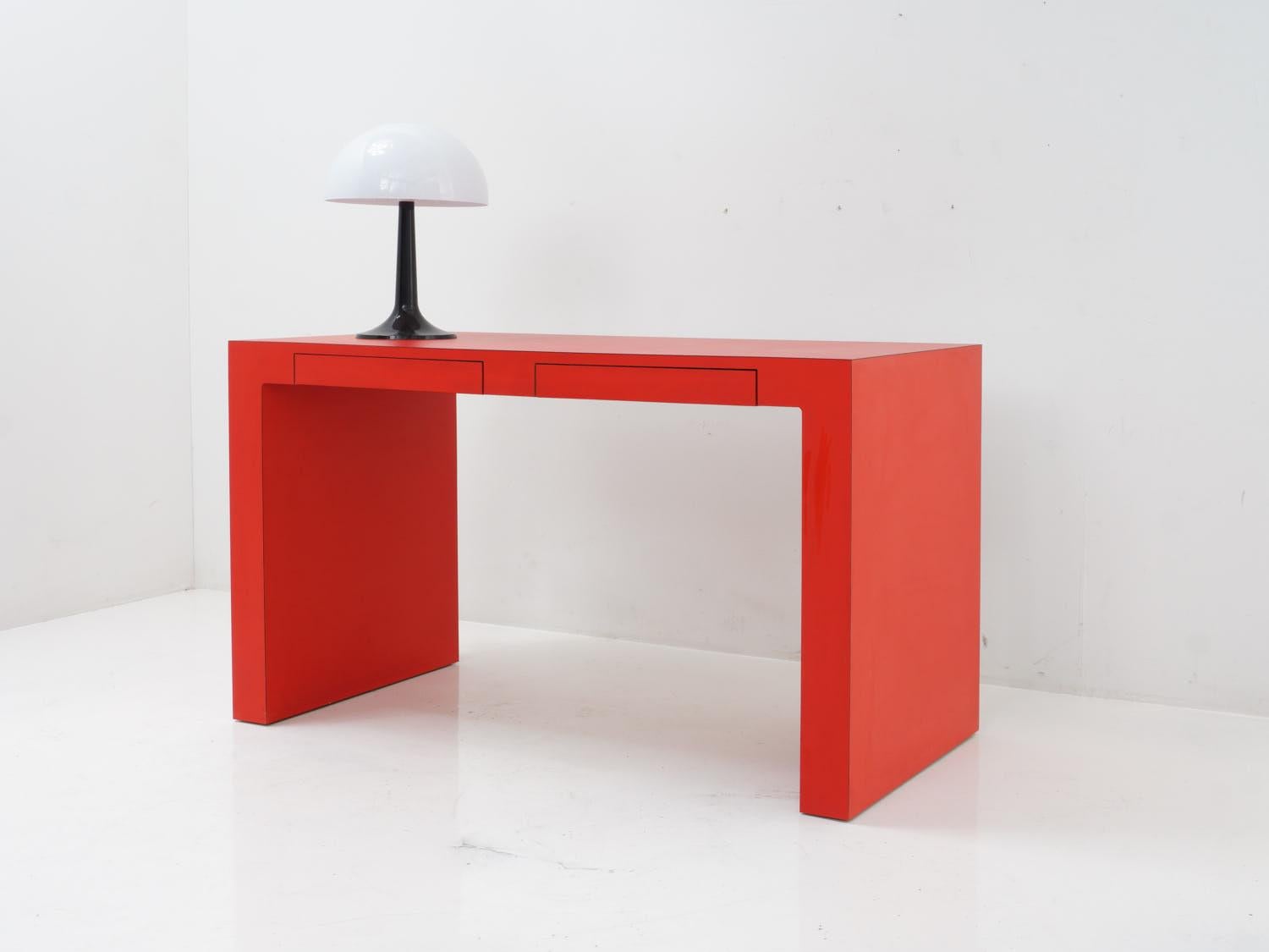 This red laminate vanity table is the perfect place to get ready for your day. Whether you're applying makeup or just staring at your reflection in admiration, the vibrant color and smooth surface will make every moment feel glamorous.

- 28