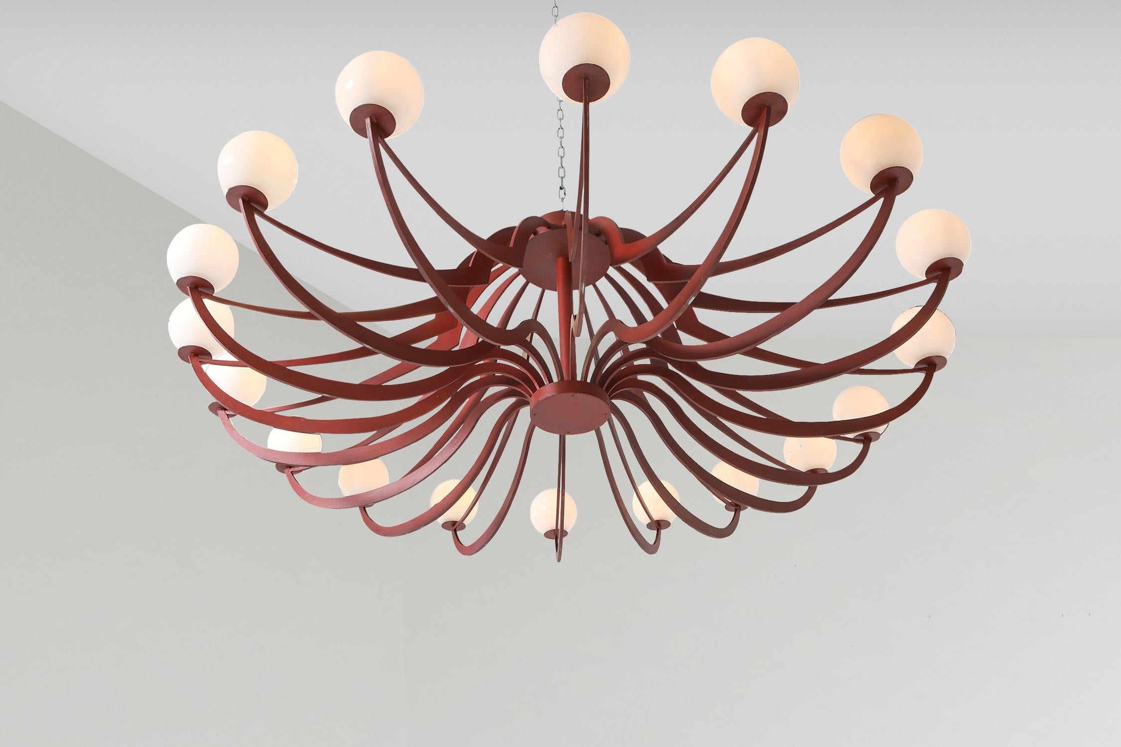 Italian pendant, lacquered steel, Postmodern, Italy, 1960s

Impressive piece with 18(!) round glass light fixtures,
Originating from a Venice hotel
The red color is slightly dark, perhaps like ox blood, it's still the original paint.

A very