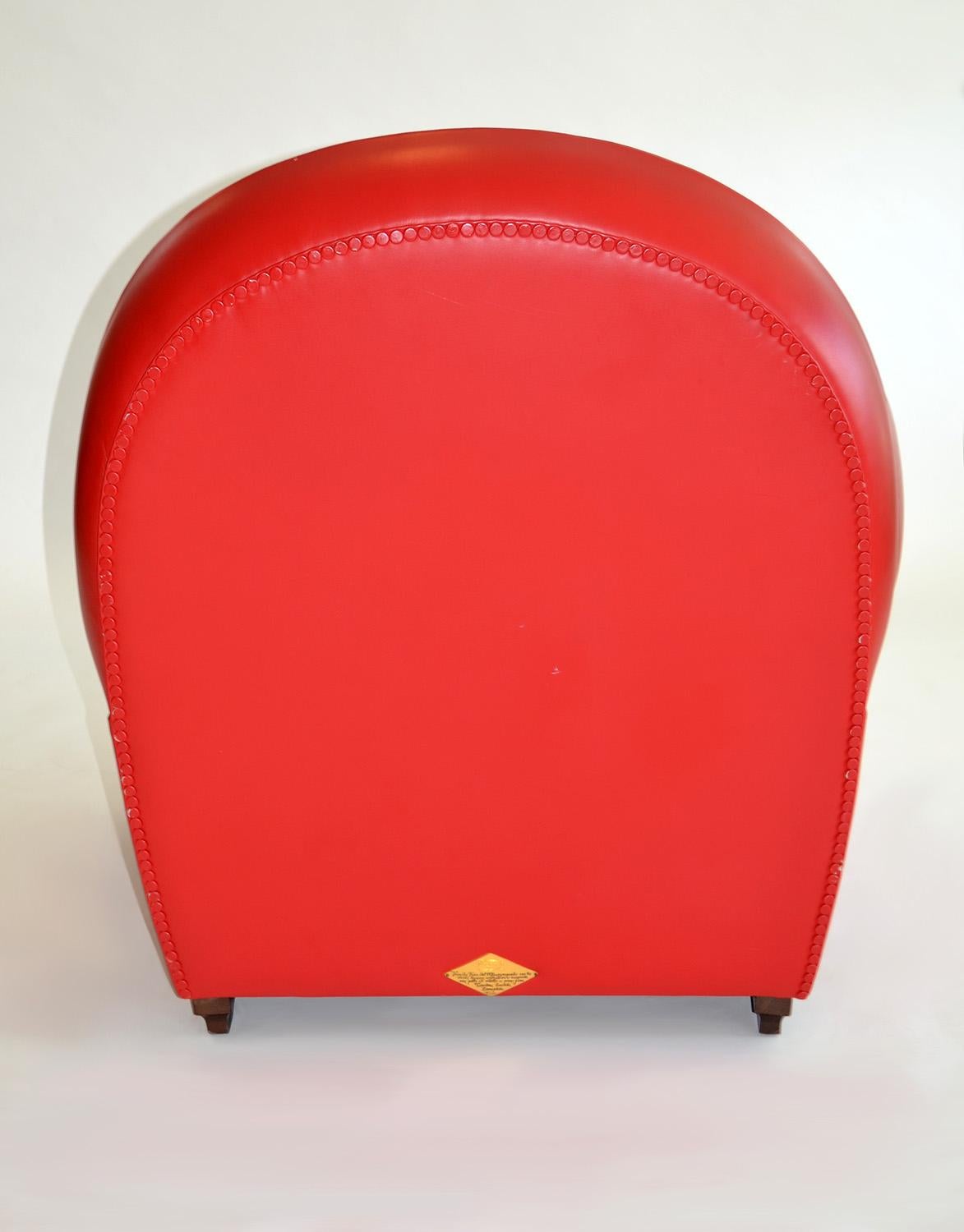 red leather chair and ottoman