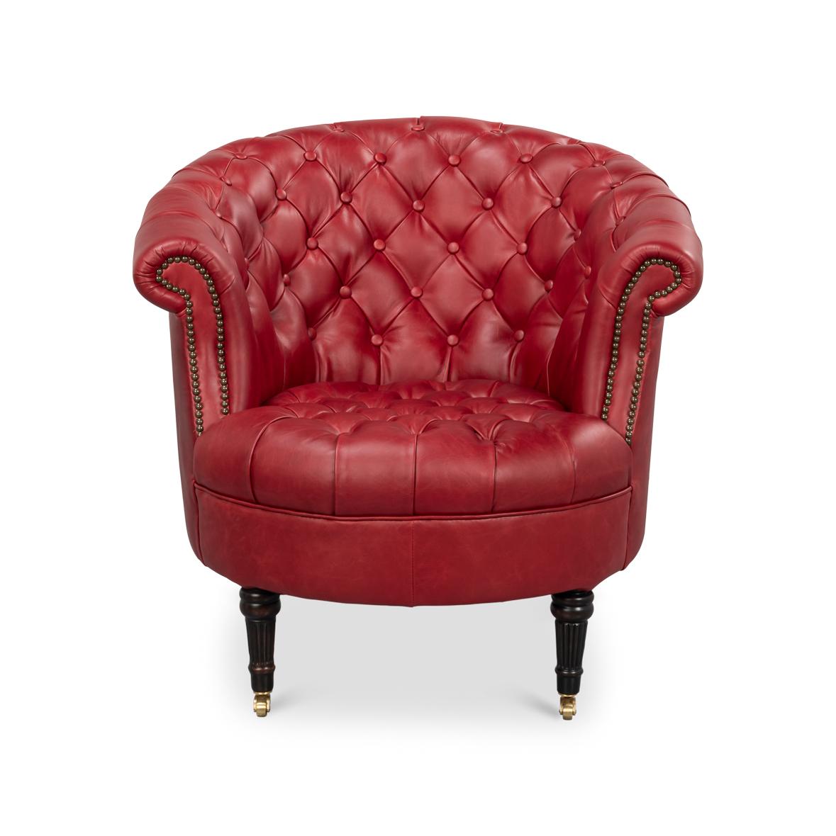 Revêtu d'un riche cuir rouge de première qualité, son dossier en tonneau élégamment incurvé est orné d'un profond capitonnage, exhalant une sophistication intemporelle.

Posée sur des pieds tournés, effilés et cannelés, cette chaise est aussi