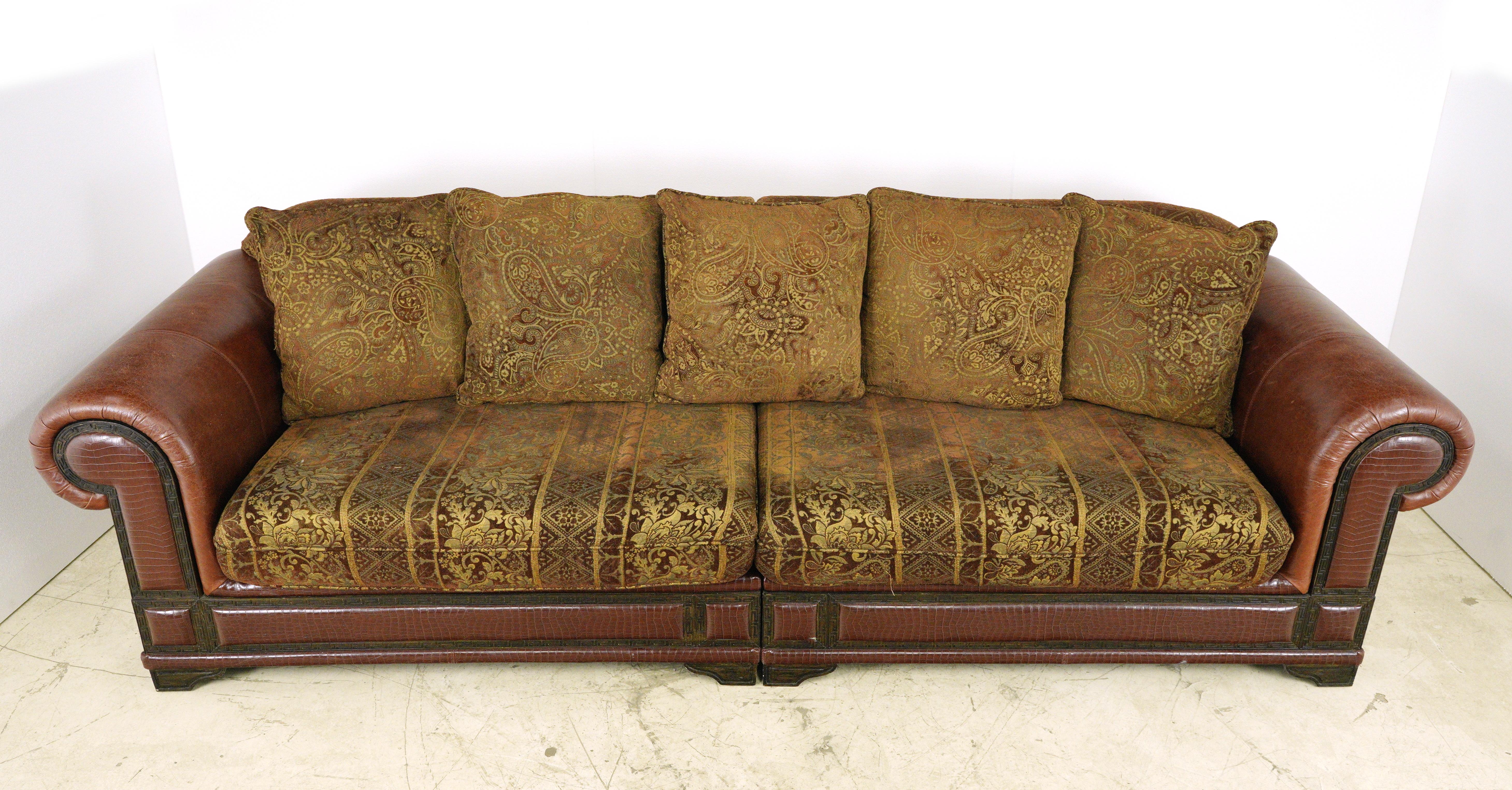 Presenting a classic ensemble for the living room, this is a three-piece seating set in traditional red leather with brown and gold accents. This sophisticated collection comprises a sofa that effortlessly separates into two pieces, a loveseat, and