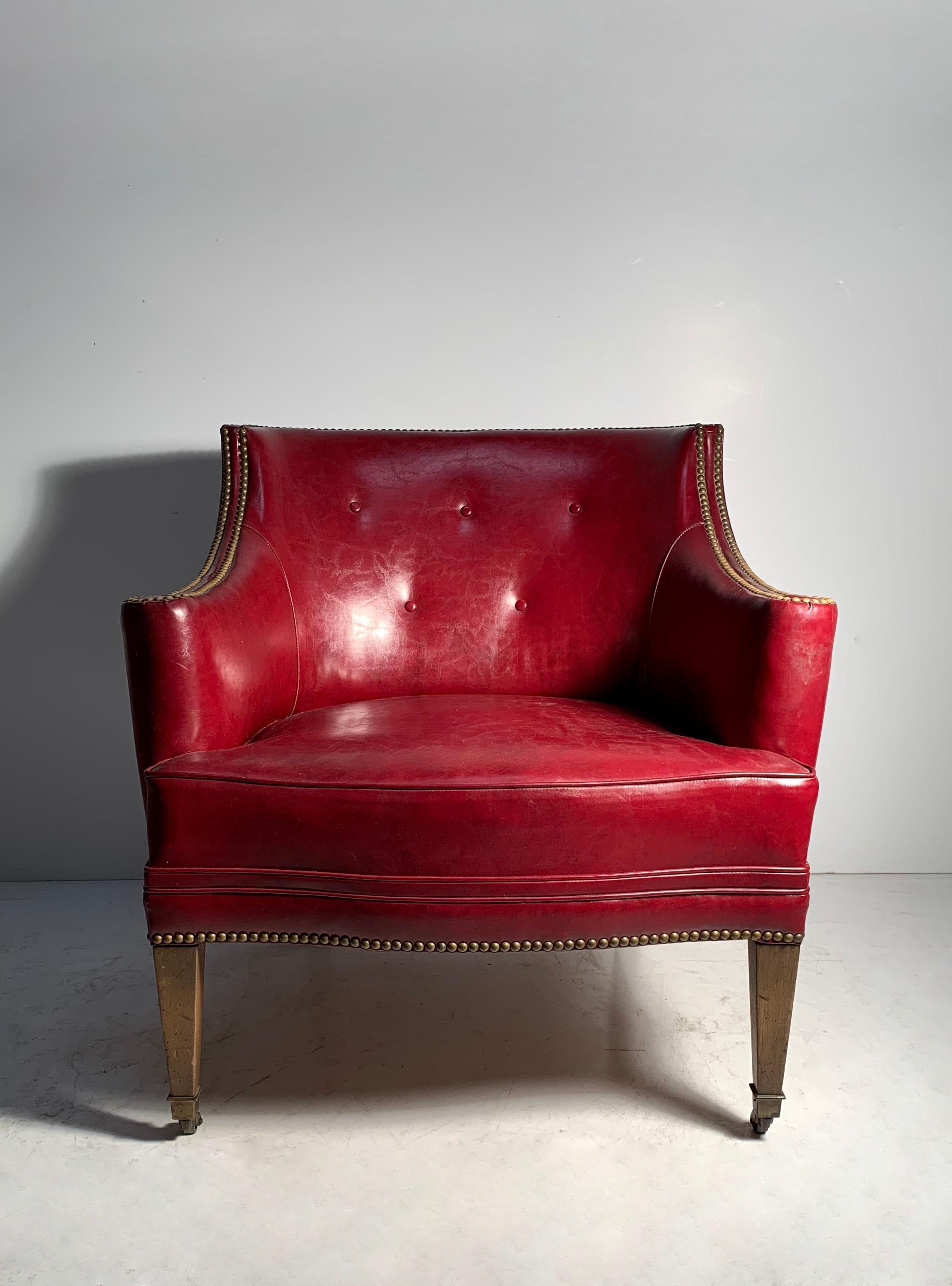 An attractive vintage red leather decorator chair. 
In the manner of Edward Wormley for Dunbar and Syrie Maugham