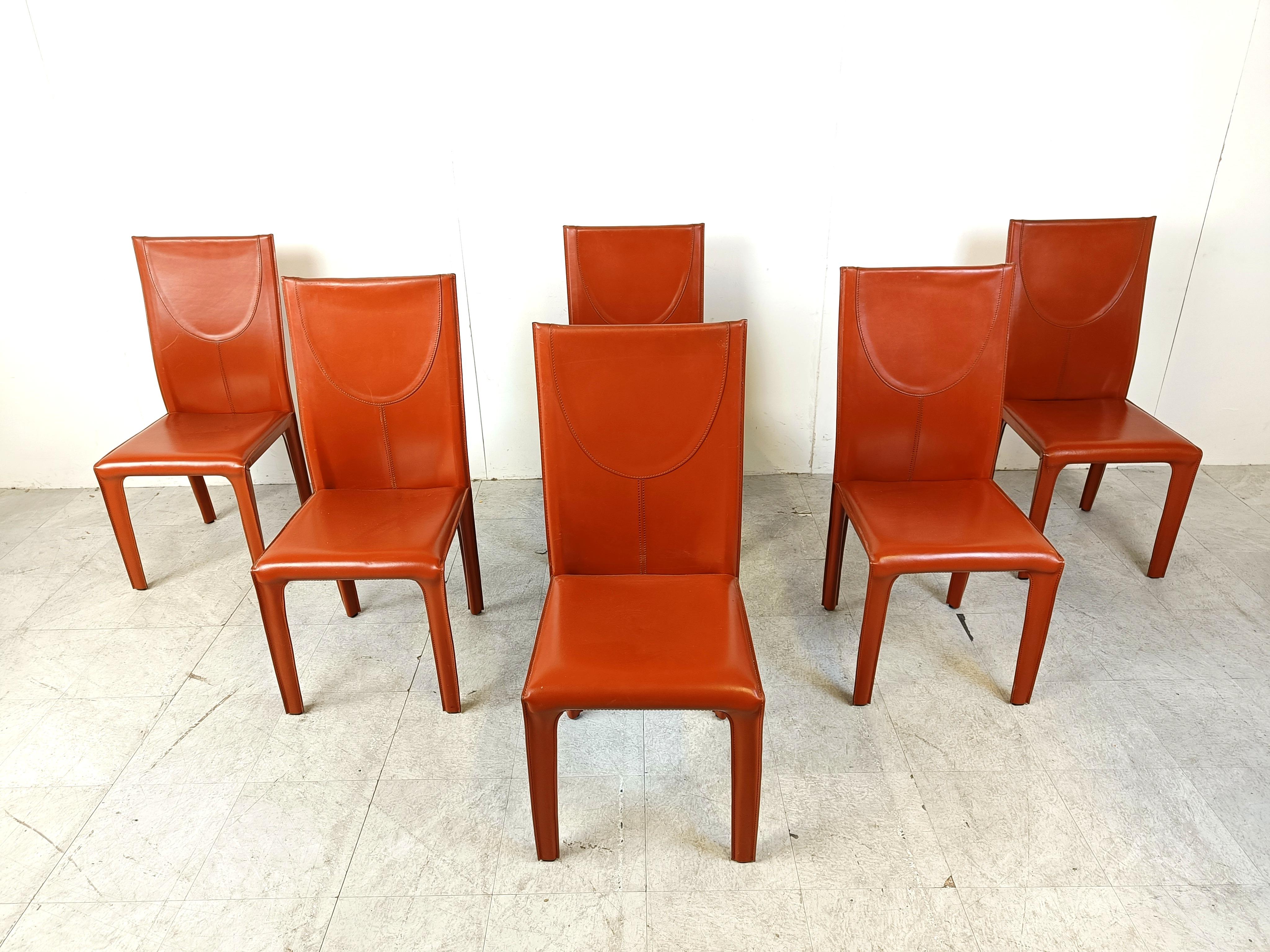 Set of 6 red stiched leather dining chairs by Arper Italy.

Very sturdy and timeless design chairs.

Good condition with normal age related wear

1980s - Italy

Dimensions:
Height: 100cm
Width x depth: 45cm
Seat  height: 45cm

Price is for the