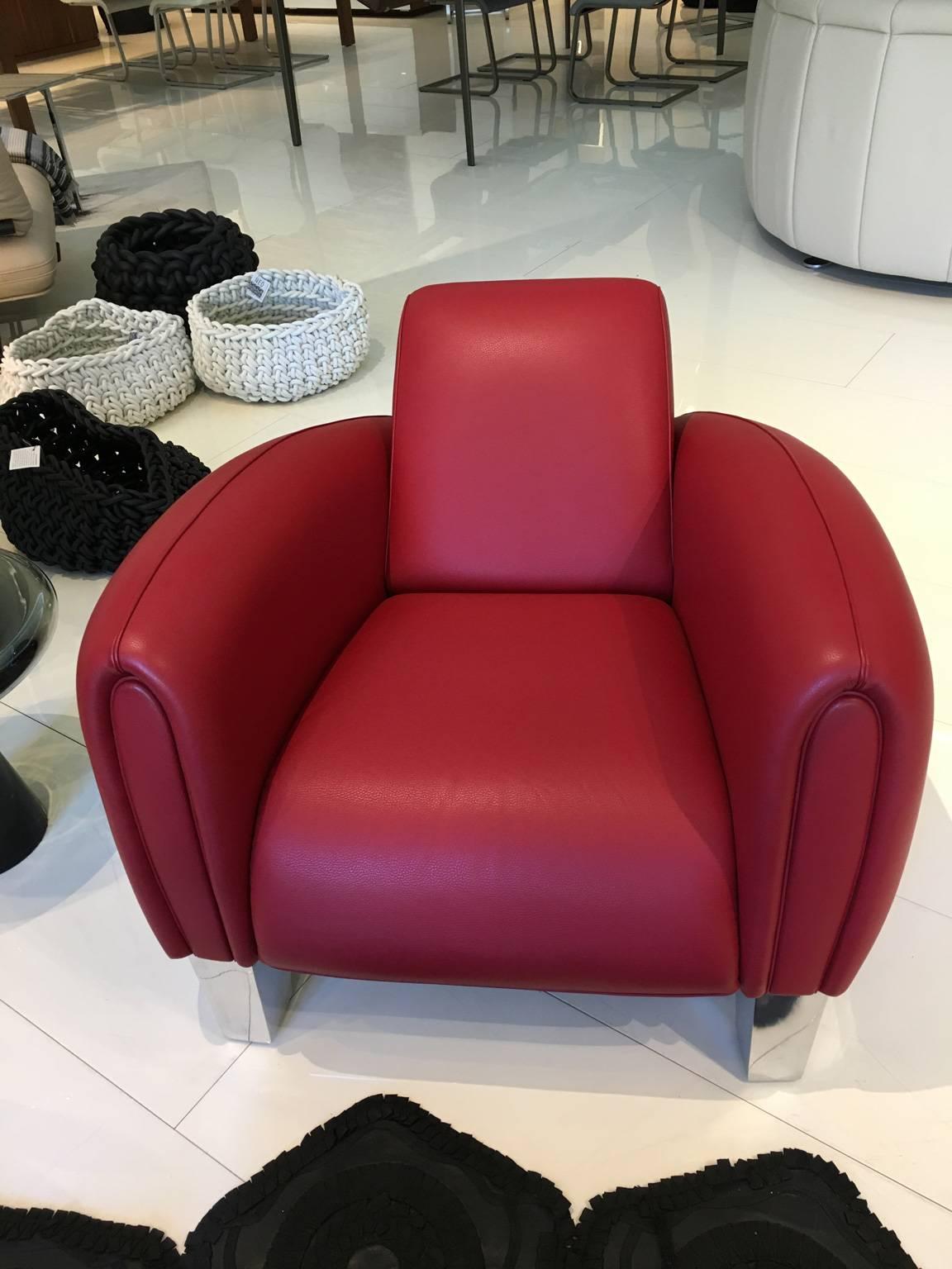 Leather lounge chair with design and seating comfort inspired by a 1930s racing car. Armchair upholstered in living leather, color Scarlet with a polished aluminum base.

Designed by Franz Romero for De Sede
Manufactured in Switzerland, 2010.
 