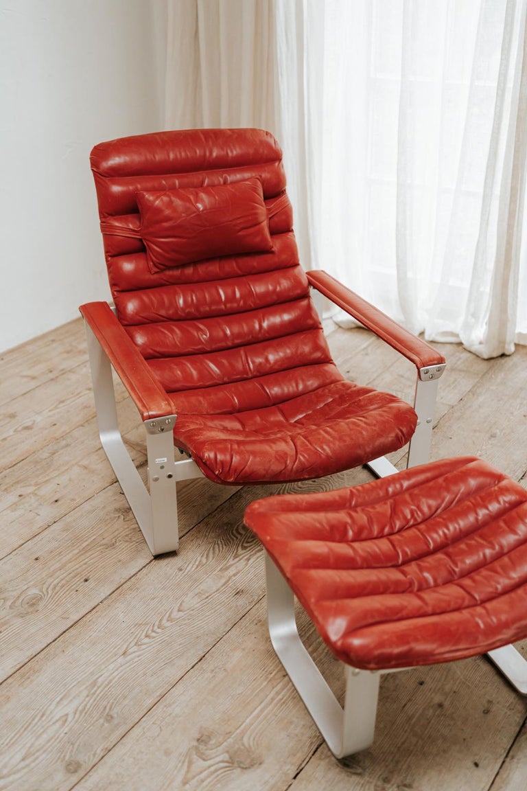 Aluminum Red Leather Lounge Chair and Ottoman, Ilmari Lappalainen For Sale