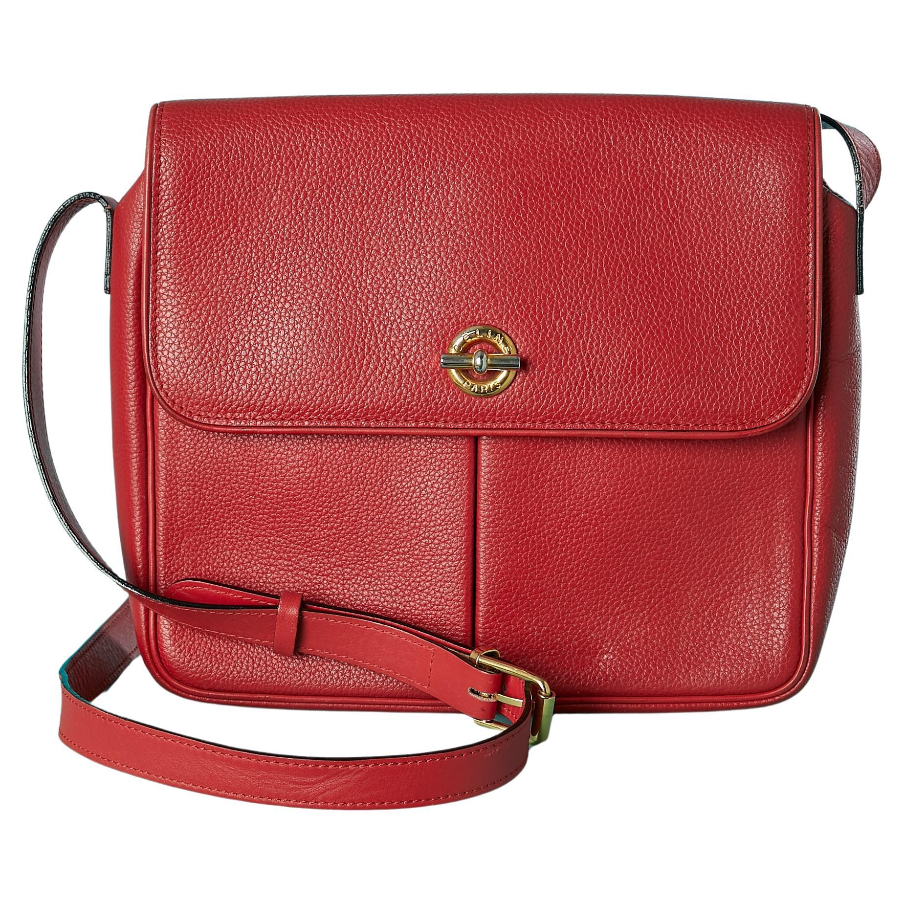 Red leather shoulder bag with gold metal hardware Céline Circa 1980's For Sale