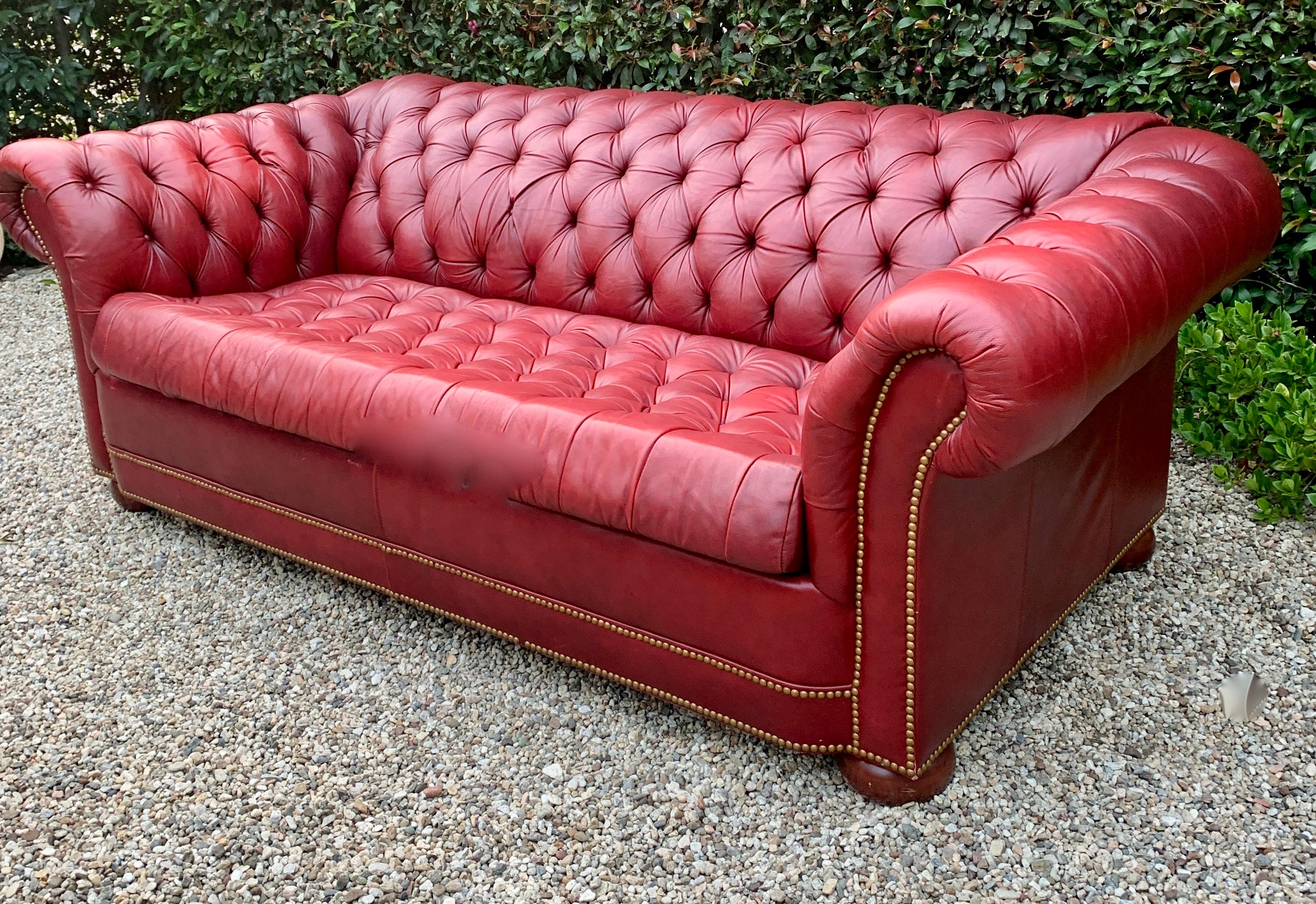 Red leather chesterfield sleeper sofa - 

Rare to find, pull-out, sleeper sofa in the sophisticated chesterfield style. A compliment to any living area, and especially a room designated for guests or guest room. The leather is wonderfully