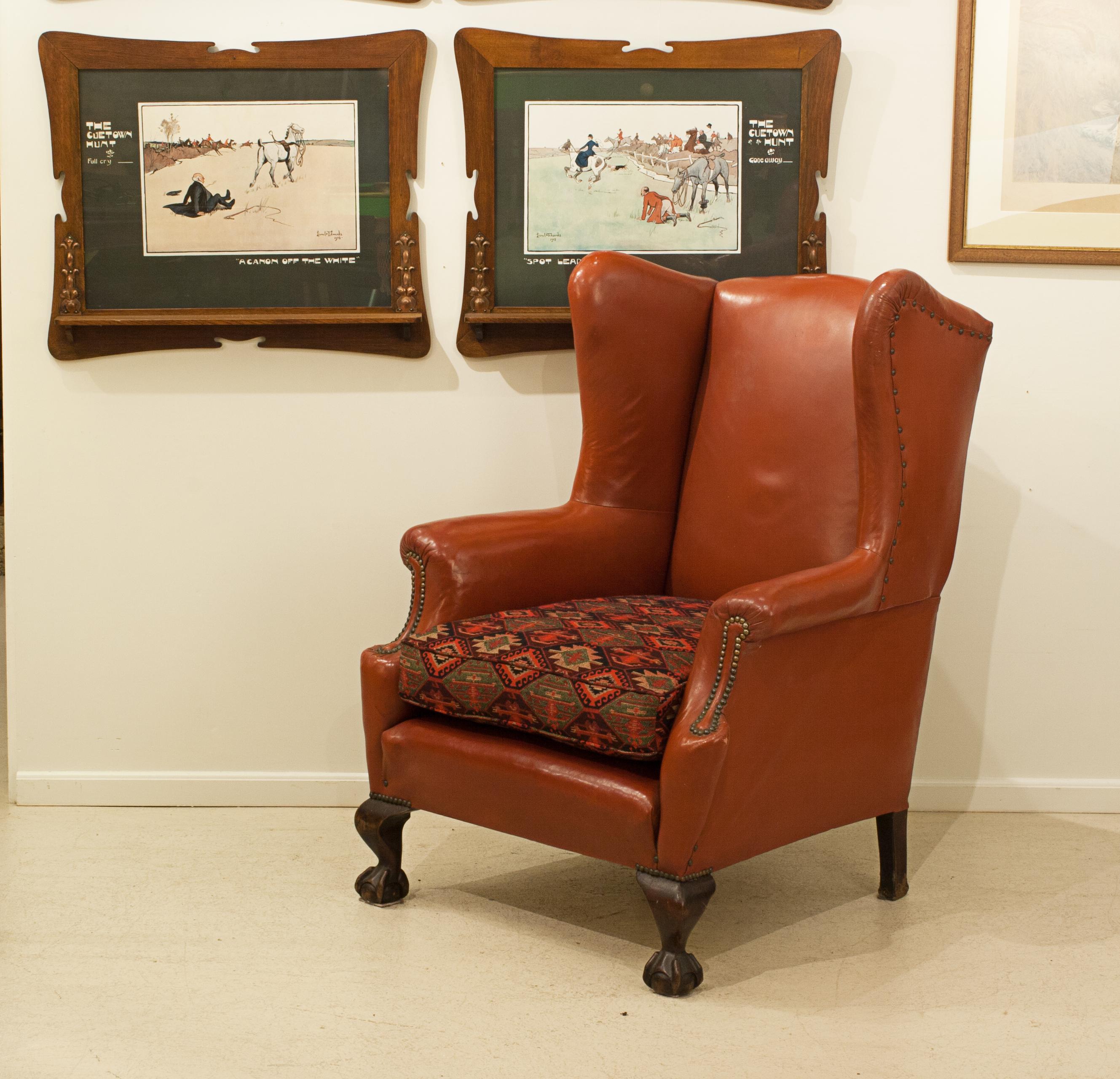 Leather Wing Armchair.
A well proportioned comfortable leather high back arm chair with good shaped wings and scrolling arms with brass studding. The arm chair supported on front claw and ball feet, short cabriolet legs and with square legs to the