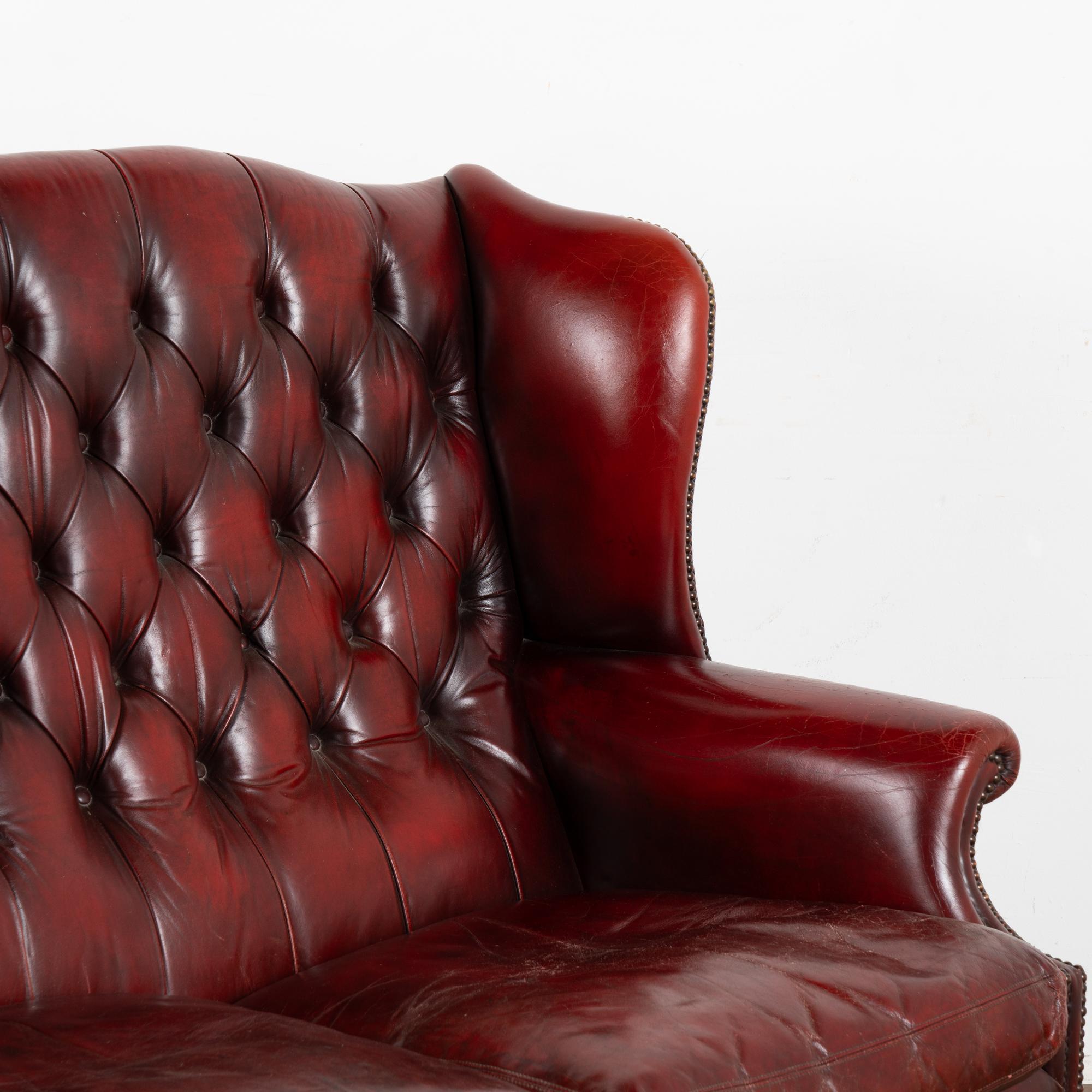 Red Leather Wingback Chesterfield Loveseat Double Chair, England circa 1960 In Good Condition For Sale In Round Top, TX