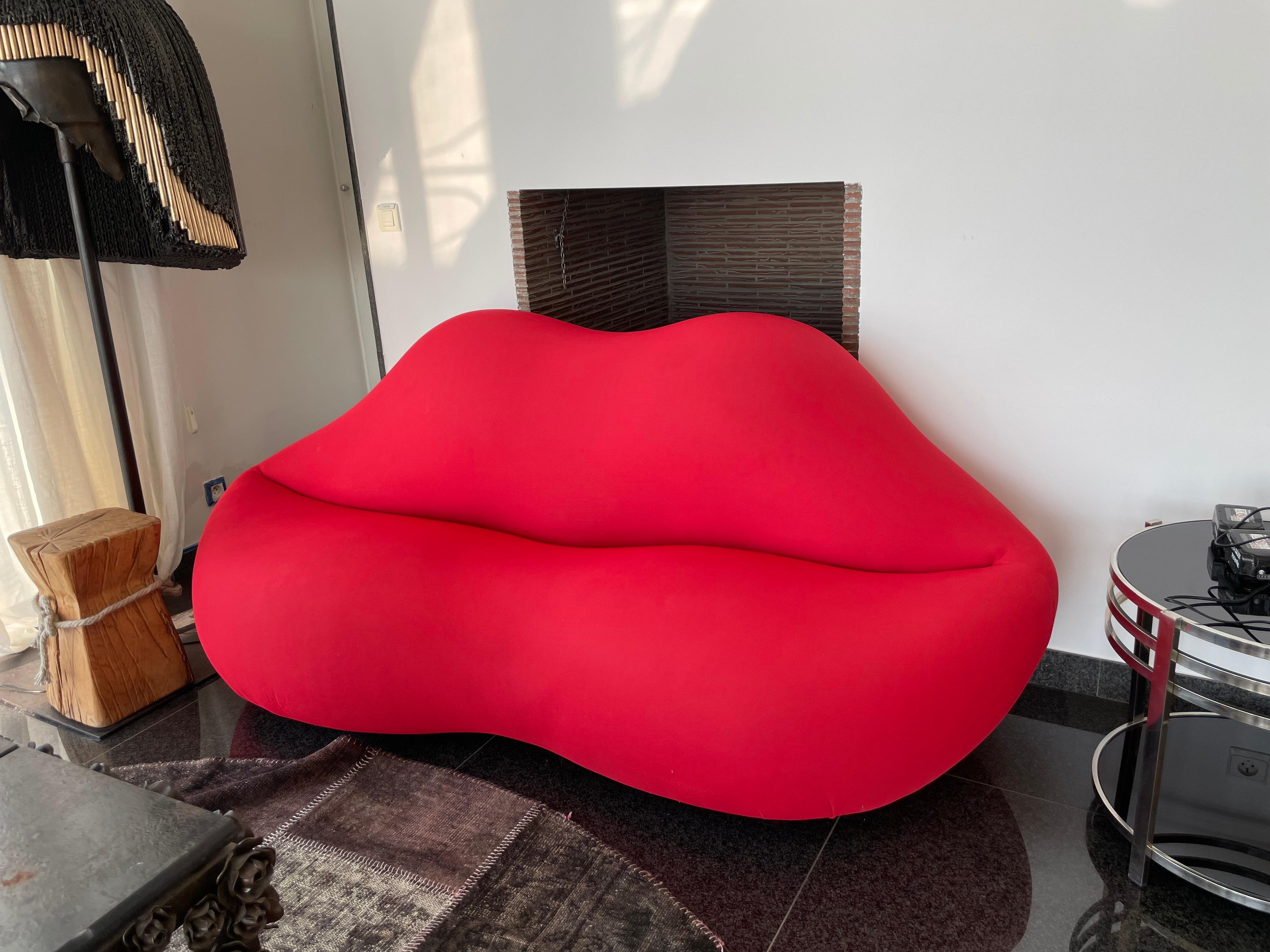 Vintage piece. 

Red Lips sofa. Bought in an art gallery in St Paul de Vence, South of France in the 1990s.

The sofa is in red fabric.

Good condition. Signs of wear consistent with normal usage.
 