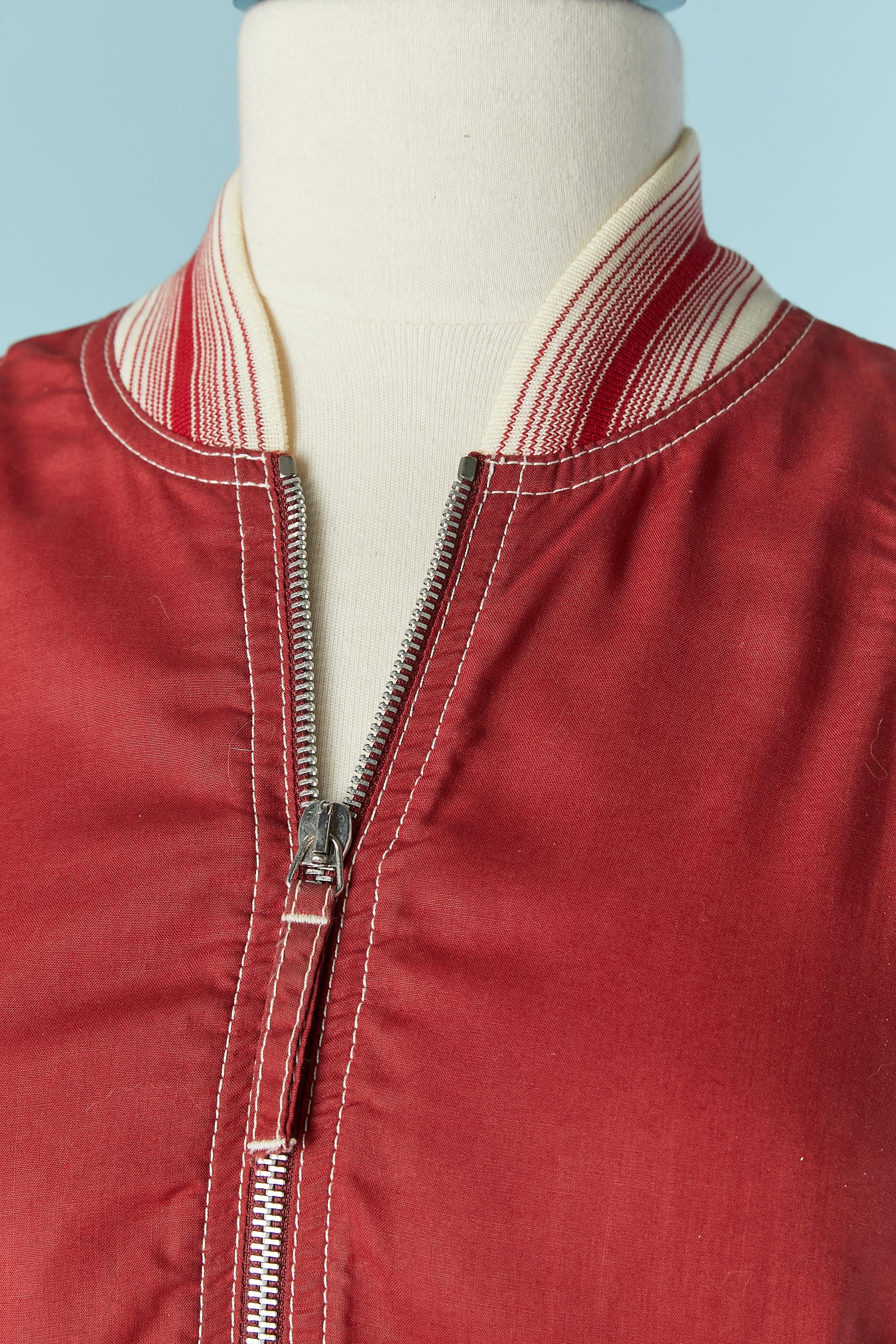 Red long jacket with ribs with zip closure on the middle front and pocket on both side. Fabric composition: 100% Tencel 
SIZE 42 (It) 38 (Fr) M
