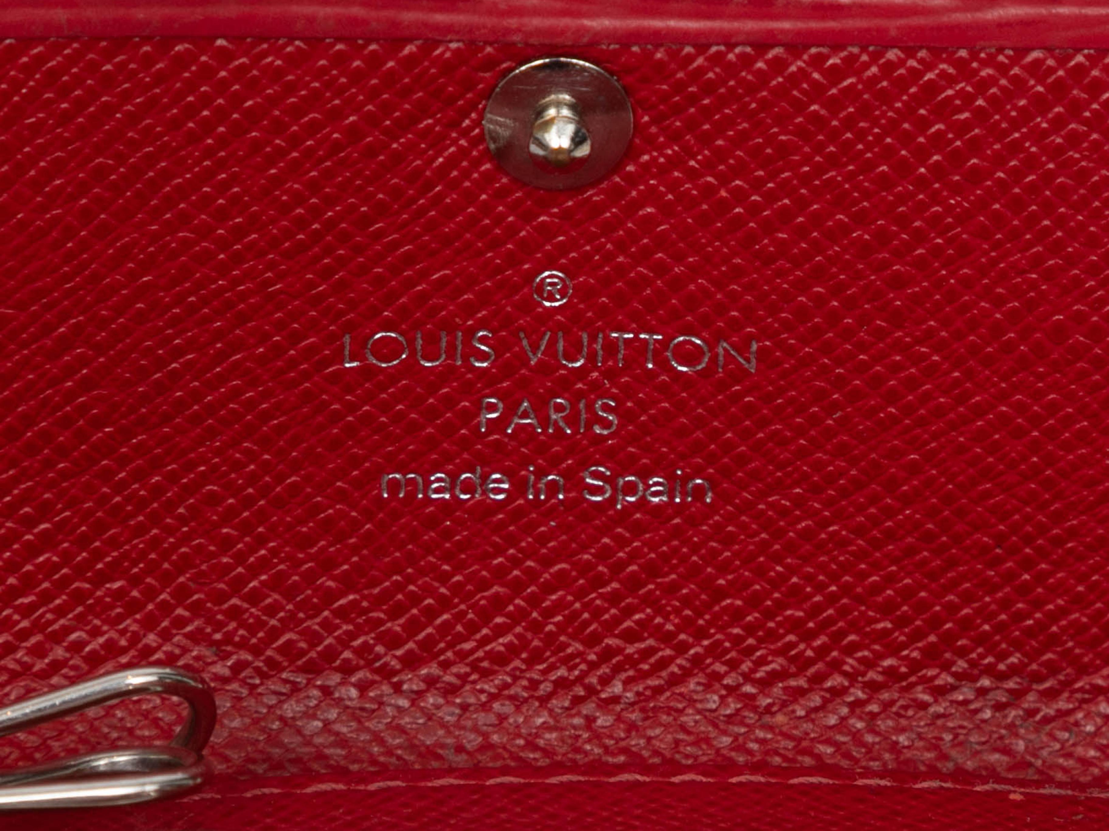 Red Epi leather key holder by Louis Vuitton. Silver-tone hardware. 2.5