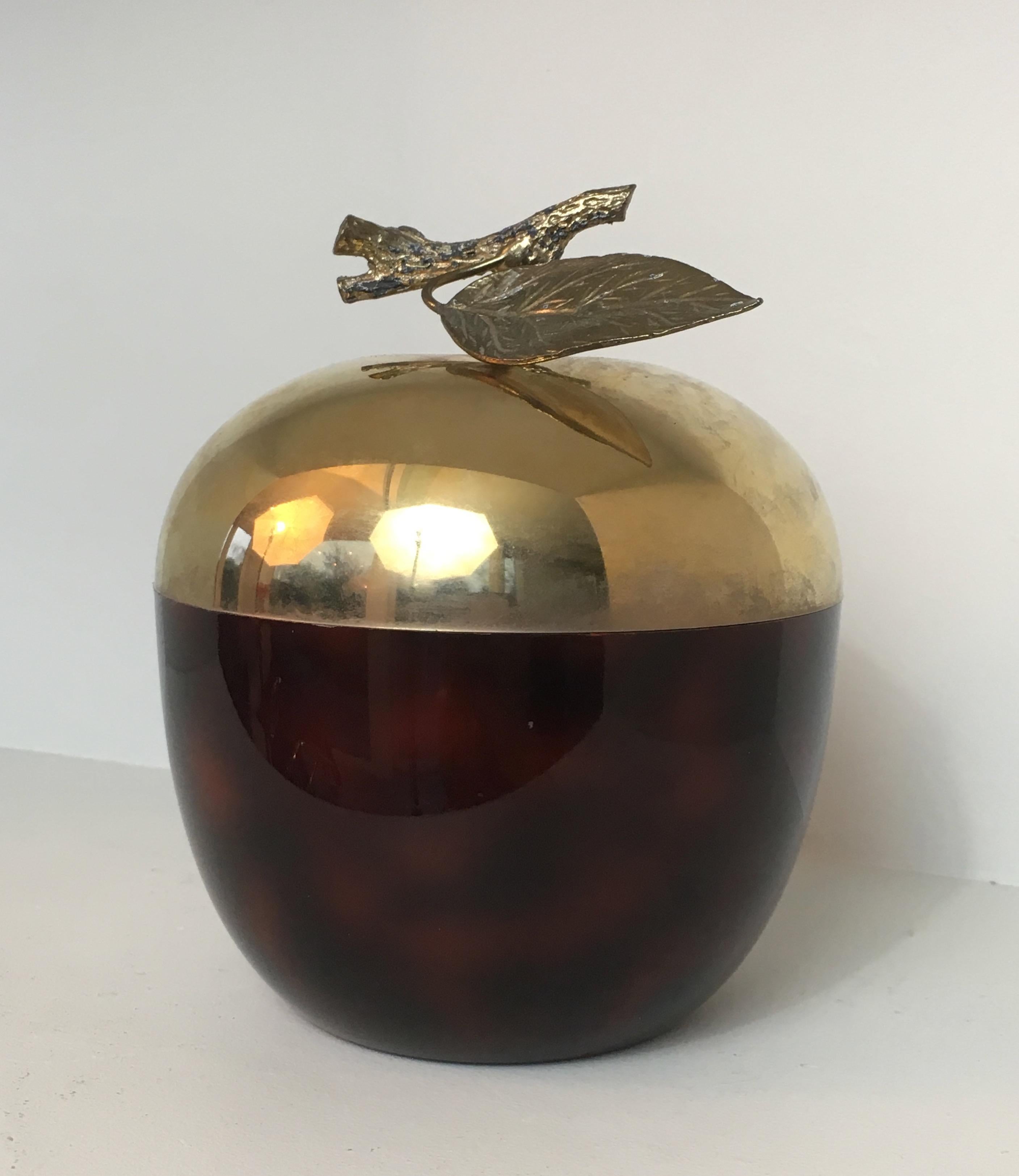This unusual apple ice bucket is made of red Lucite, gilt metal and plastic. This is a French work, circa 1970.
