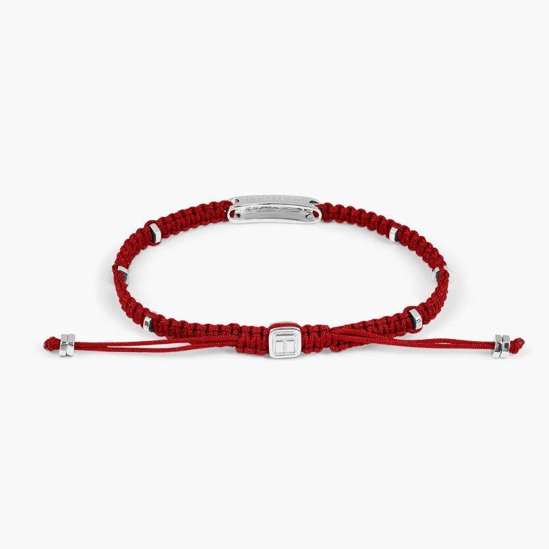 Red macramé bracelet with rhodium baton, Size L

The engravable sterling silver bar is set with rhodium plated, sterling silver disc elements added around the bracelet to give little flashes of light throughout the design. Our intricately