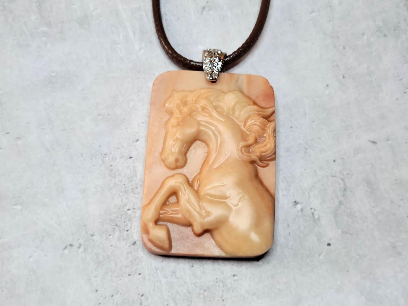 Hand Carved Red Malachite Horse Pendant.

The pendant is a detailed rectangular cameo made of red malachite, 60mm x 40mm. Beautiful and rare item!
Red 