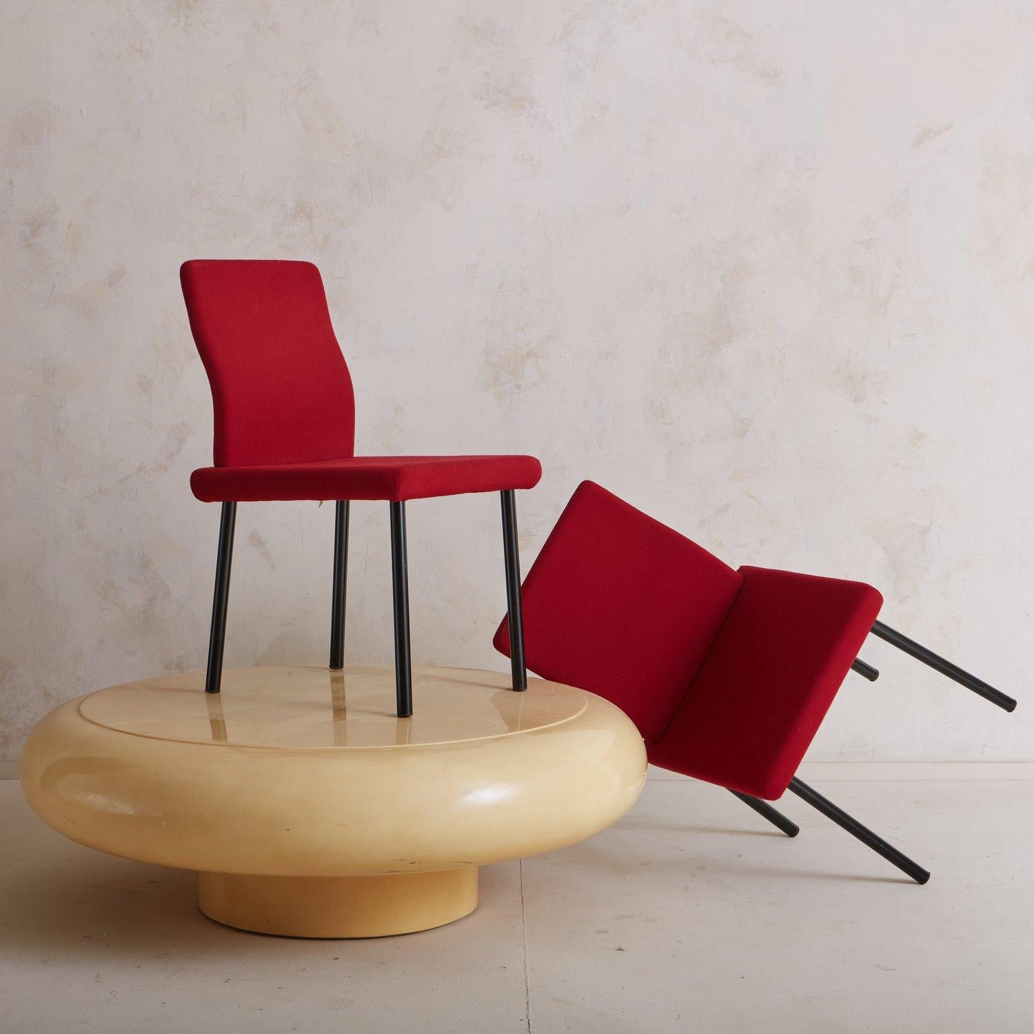  An iconic Mandarin chair designed by Ettore Sottsass for Knoll in 1986. This chair features vibrant red upholstery and sleek black enameled steel legs. We love the unusual proportions and slight curve in the seat back. ‘Knoll 1995 Made in Italy +