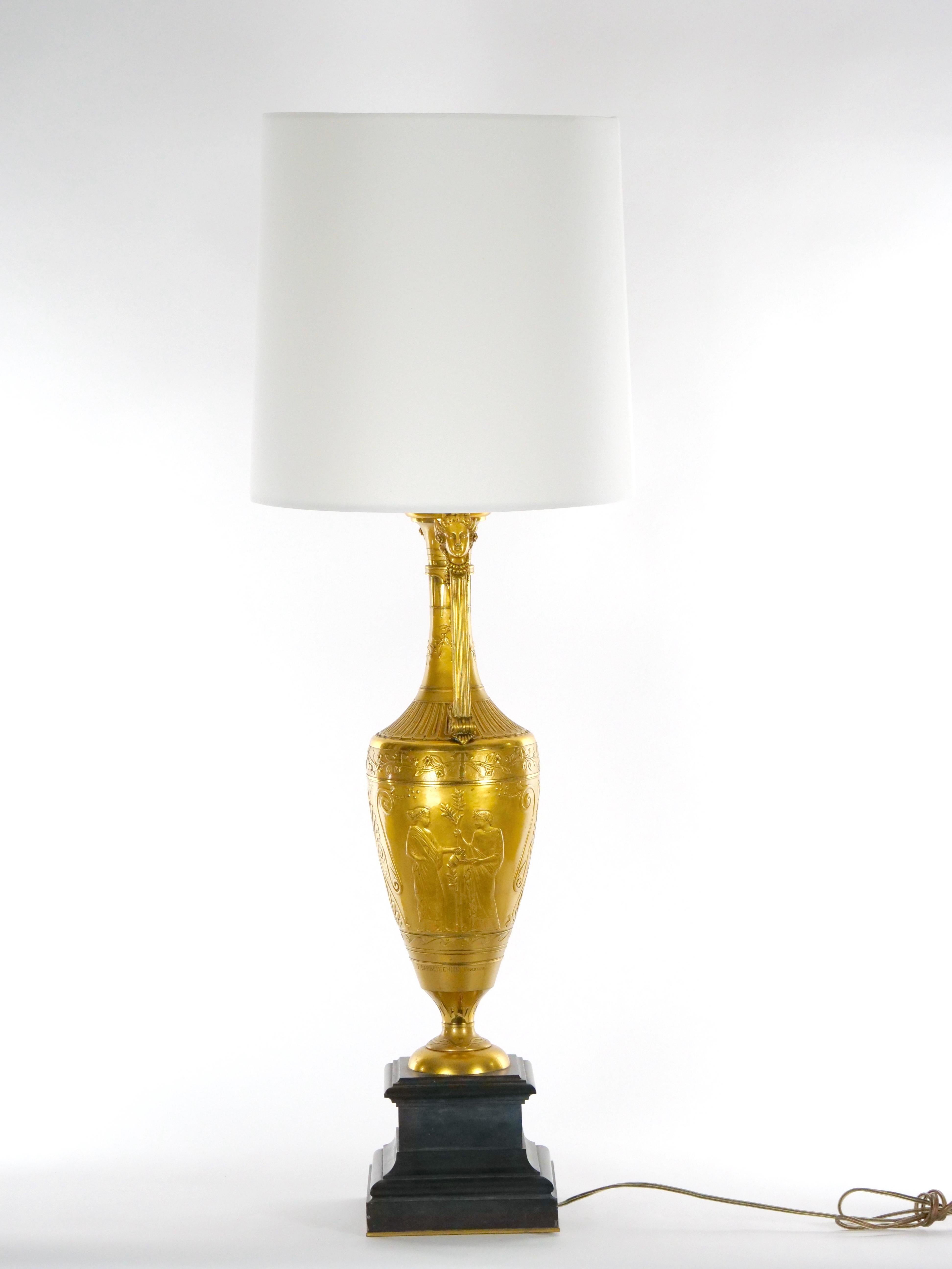 Exceptional gilt bronze and black marble base table lamp. Made by the famed maker F. Barbedienne the lamp was crafted from black squared marble base and gilt bronze in the Napoleon III style. The lamp features an amphora urn shape form with two side