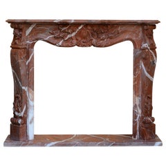 Red marble fireplace surround or front. After french Louis XV style. 20th cent
