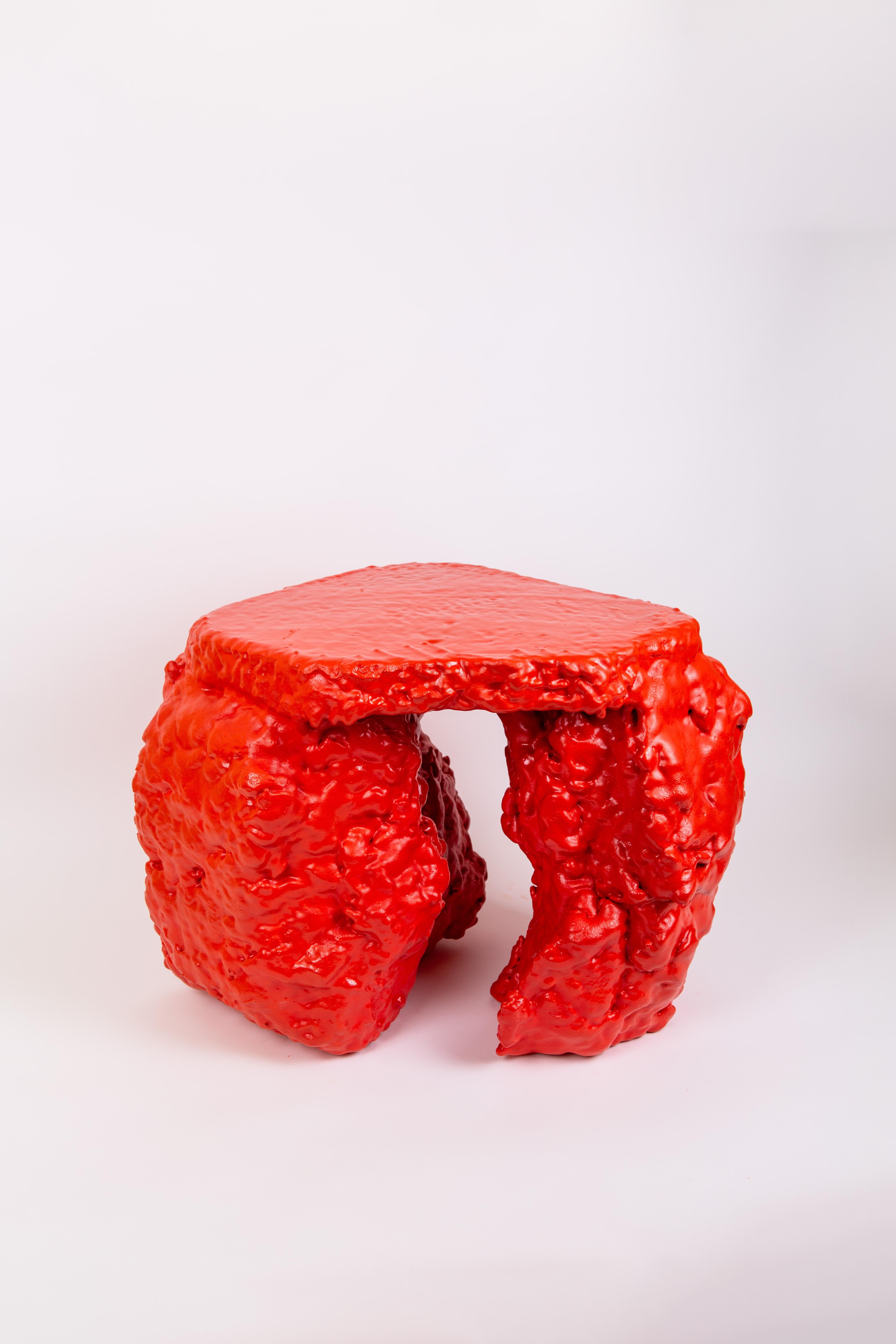 Red mass table by Sara Regal
Dimensions: D 45 x W 44 x H 45 cm
Materials: recycled plastic, pigments, concrete, polystyrene, lacquer
Customisable colors and measures, gloss or satin finish available,

Table made of compressed recycled waste