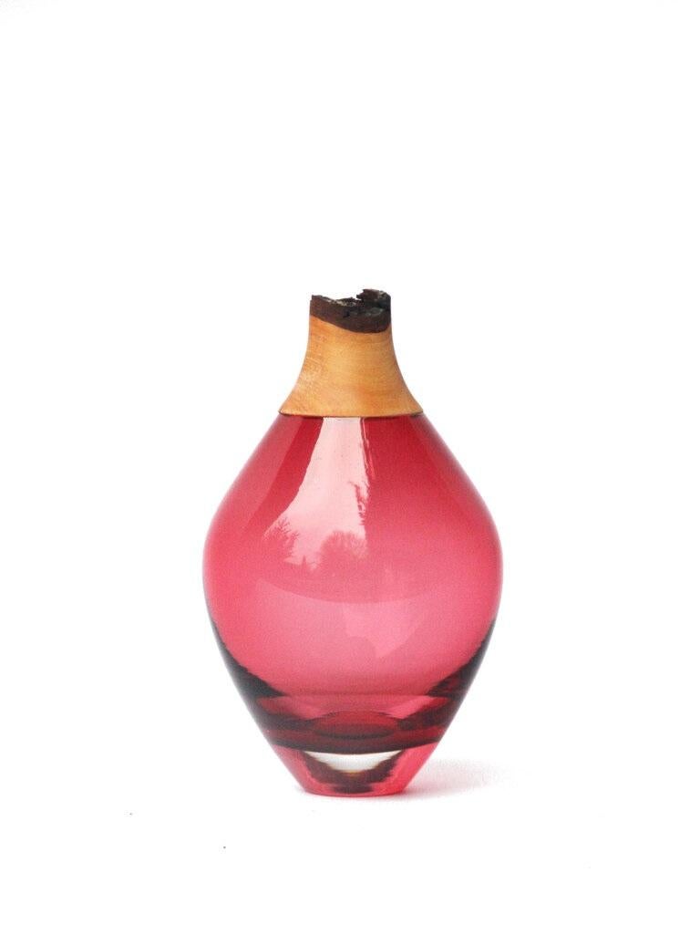 Red Matisse stacking vessel III, Pia Wüstenberg
Dimensions: D 11 x H 21
Materials: glass, wood
Available in other colors.

The Matisse stacking vessels are treasures, small splashes of curvy glass with a wooden crown. The collection was