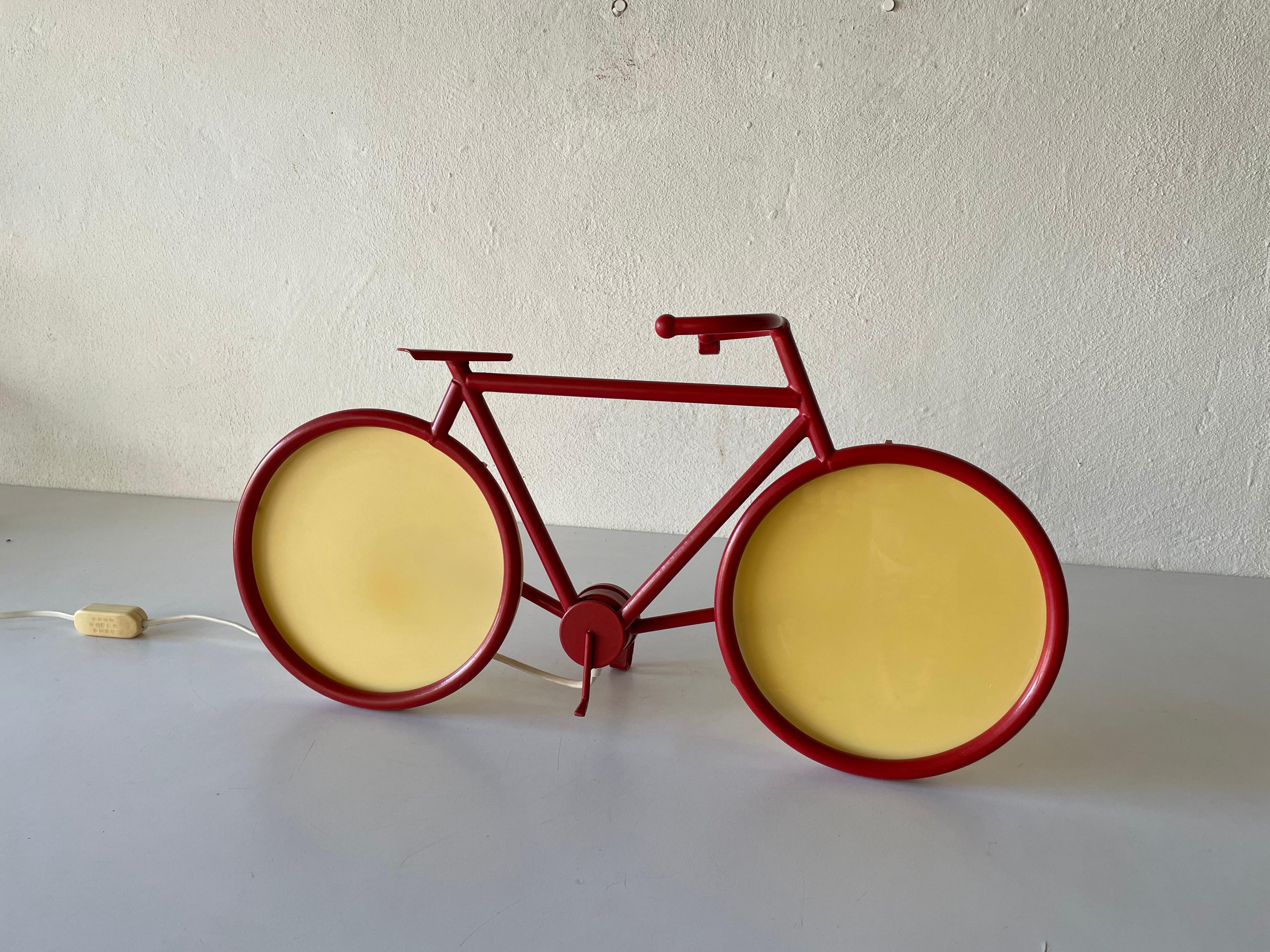Red metal bicycle table lamp or wall lamp by Zicoli, 1970s Italy

Very rare large desk lampor wall lighting
Plastic rims.
Very high quality.
Fully functional.

Original cable and plug. This lamp is suitable for EU plug socket. Switch on-off