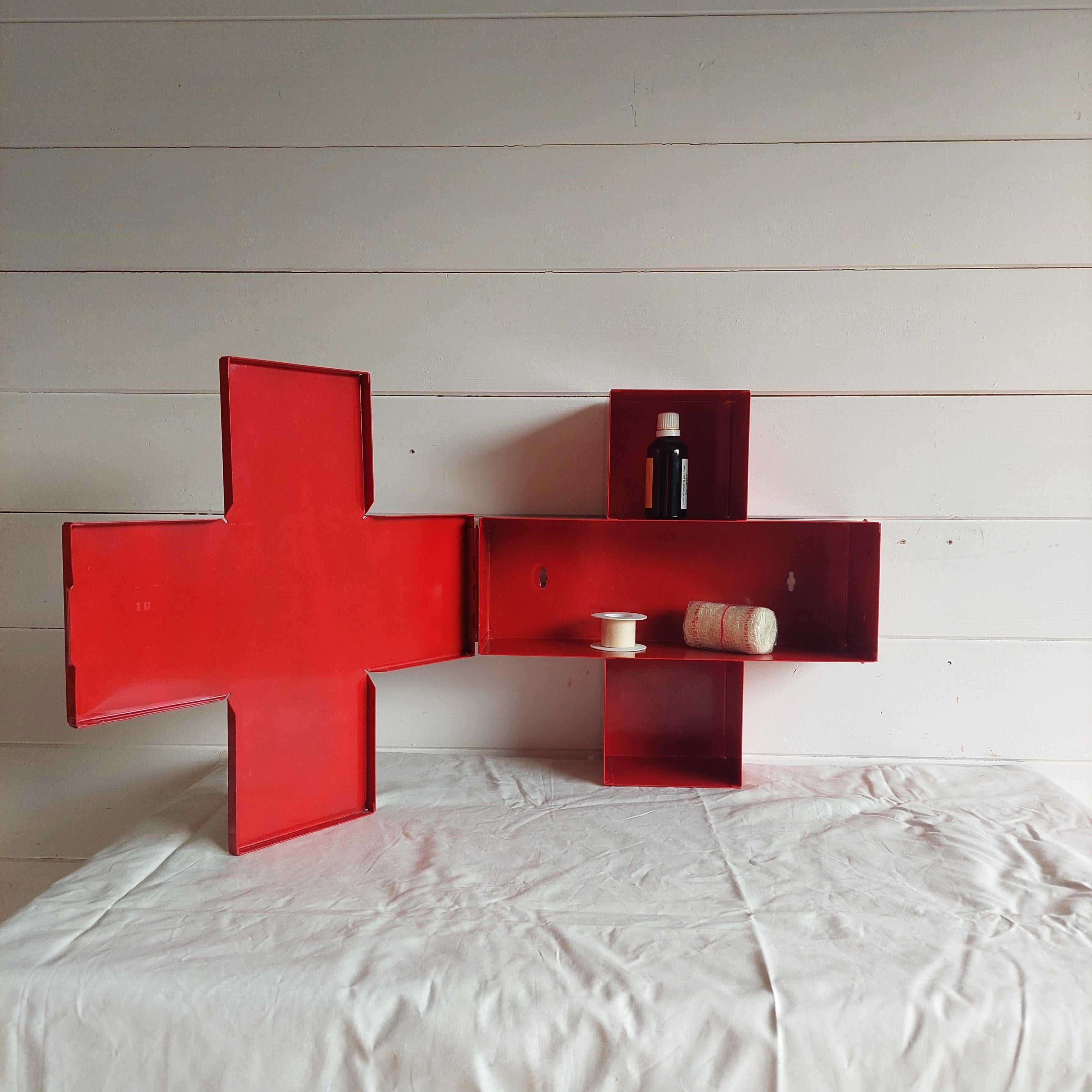 Cappellini style RED CROSS CABINET. 
The original was designed by artist Thomas Ericksson in 1992 

Symbolic design… Swedish designer Thomas Eriksson won several prices and his work is found in the permanent exhibition at the MoMA (Museum of Modern