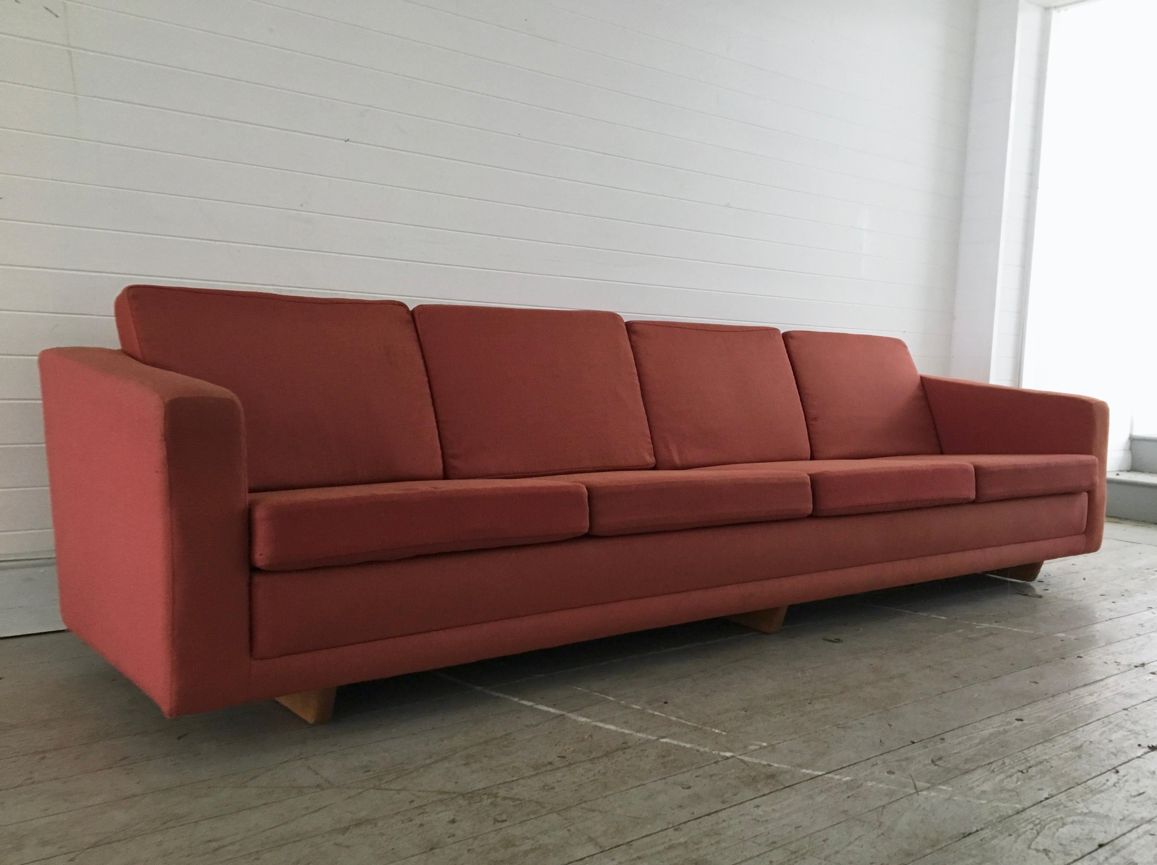 Exquisite, long, 4-Seat sofa designed by Danish icon Borge Mogensen for Fredericia Mobler, circa 1960. Original red wool upholstery with 3 solid beech sleigh supporting legs.

Dimensions (cm, approx): 
H 69 
W 270 
D 76

Condition: The