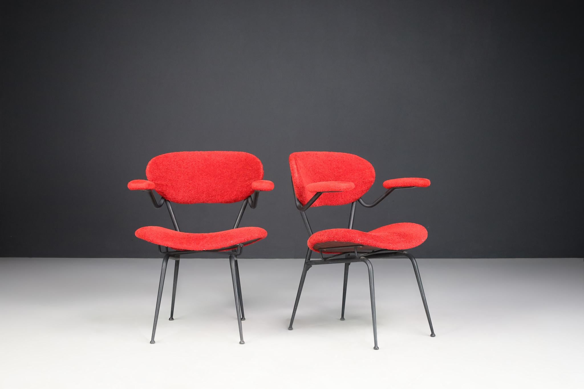 Red Mid-century Modern Armchairs by Gastone Rinaldi, Italy 1960s 
 
Gastone Rinaldi designed this beautiful and iconic pair of rare armchairs in 1954, Italy. The shape of the armchairs is sculptural, unique, and extraordinary: the two soft armrests