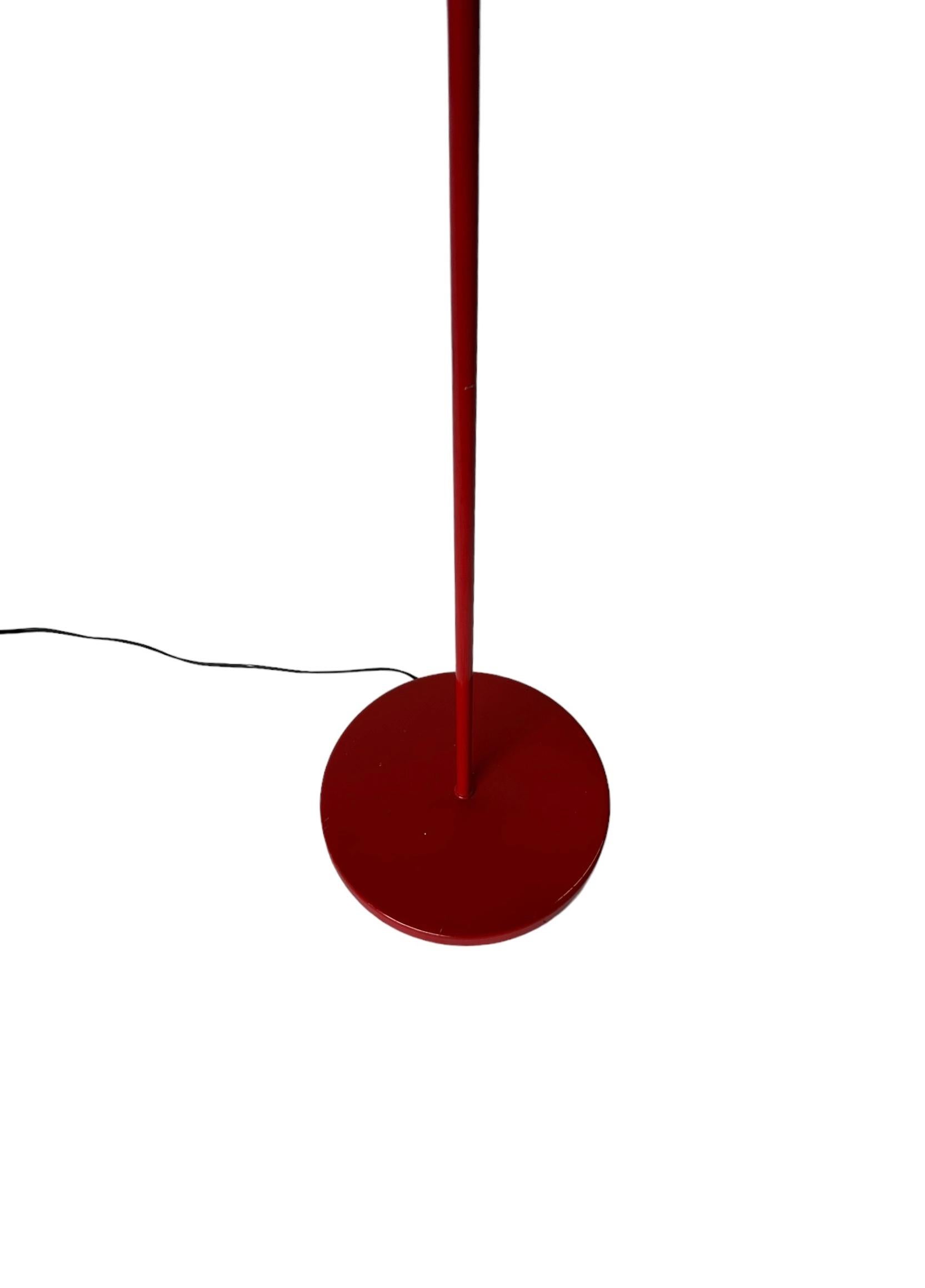 Cool minimalist floor lamp in red enamel. Bold tone with simple lines for a unique look. Available with lampshade for additional $99.