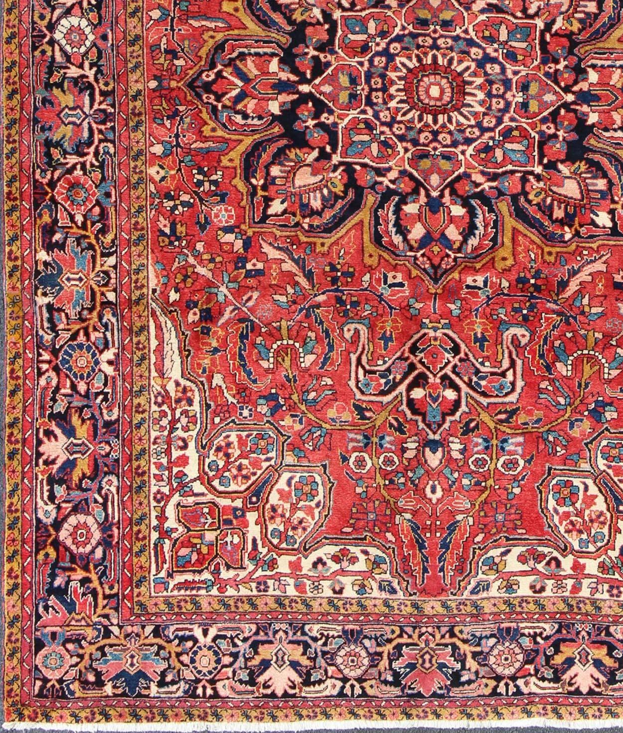 Large Semi Antique Persian Heriz rug with stylized medallion design, rug fn-5938, country of origin / type: Iran / Heriz, circa 1950

This magnificent antique Persian Heriz carpet from the mid-20th century (circa 1950) bears an exquisite design