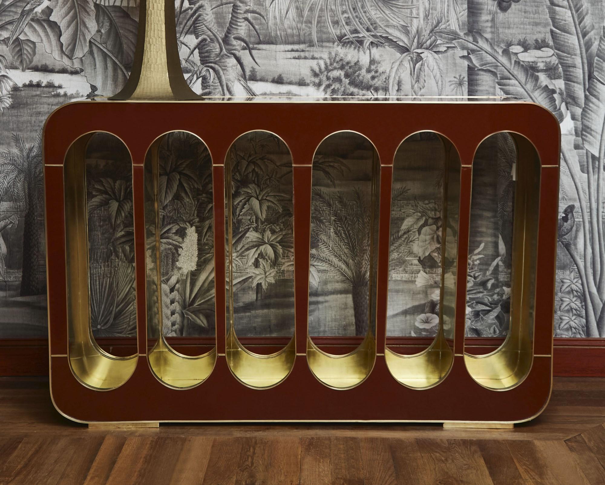 Console in red tainted mirror and brass inlays. Creation by Studio Glustin.