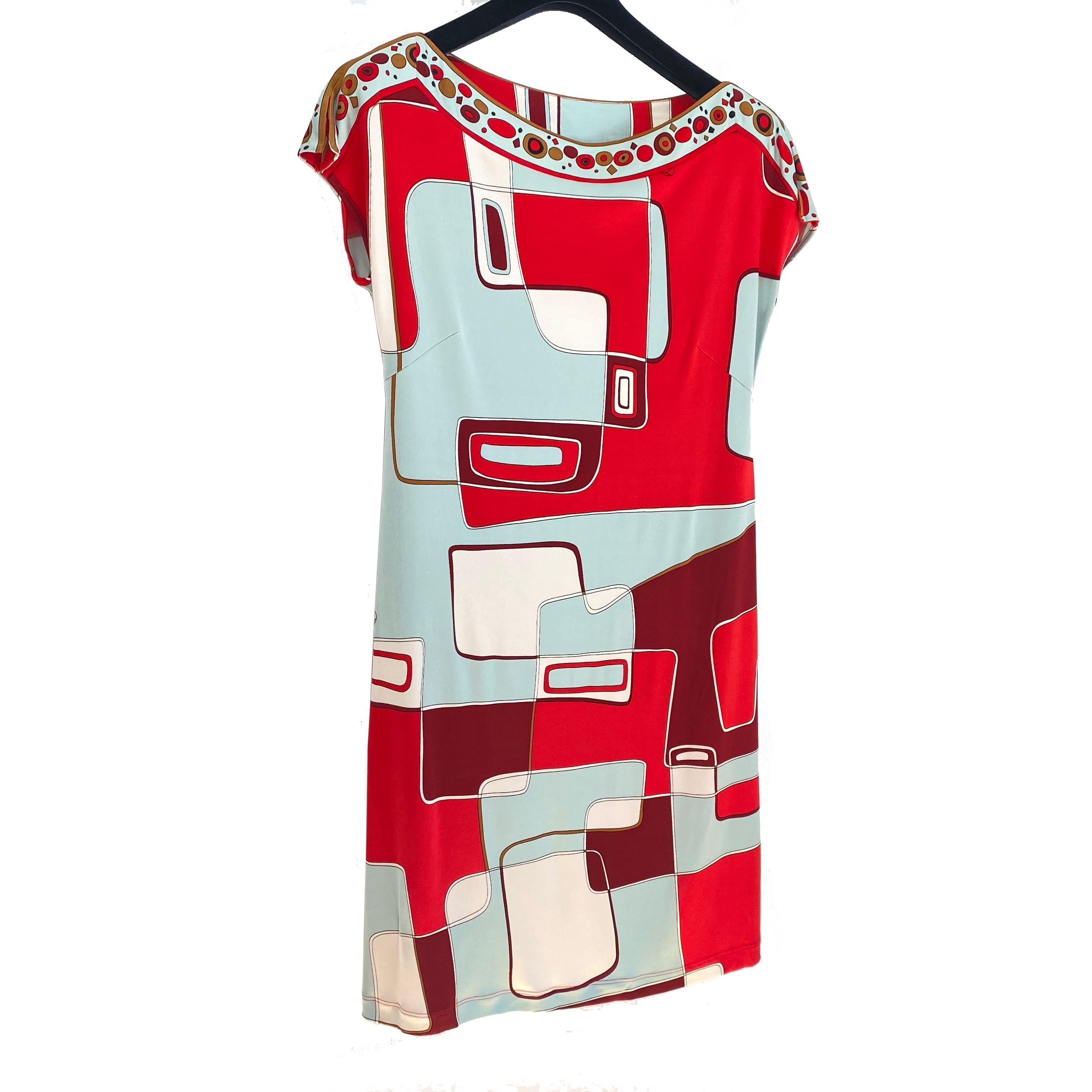Easy and flattering tunic shift dress with belt in original red and aqua mint signed print.
Approximately 36.5