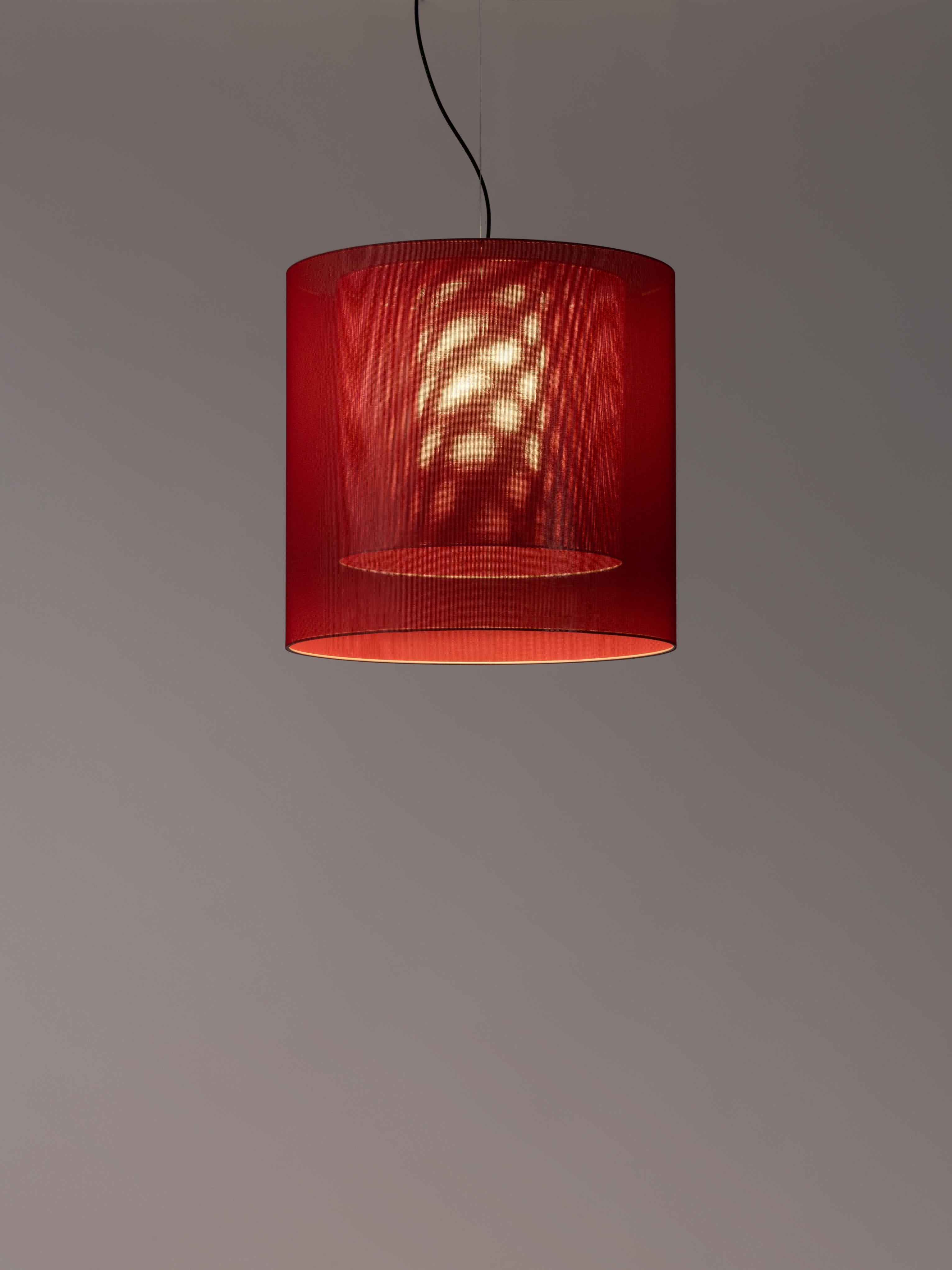 Red Moaré LM pendant lamp by Antoni Arola
Dimensions: D 62 x H 60 cm
Materials: Metal, polyester.
Available in other colors and sizes.

Moaré’s multiple combinations of formats and colours make it highly versatile. The series takes its name