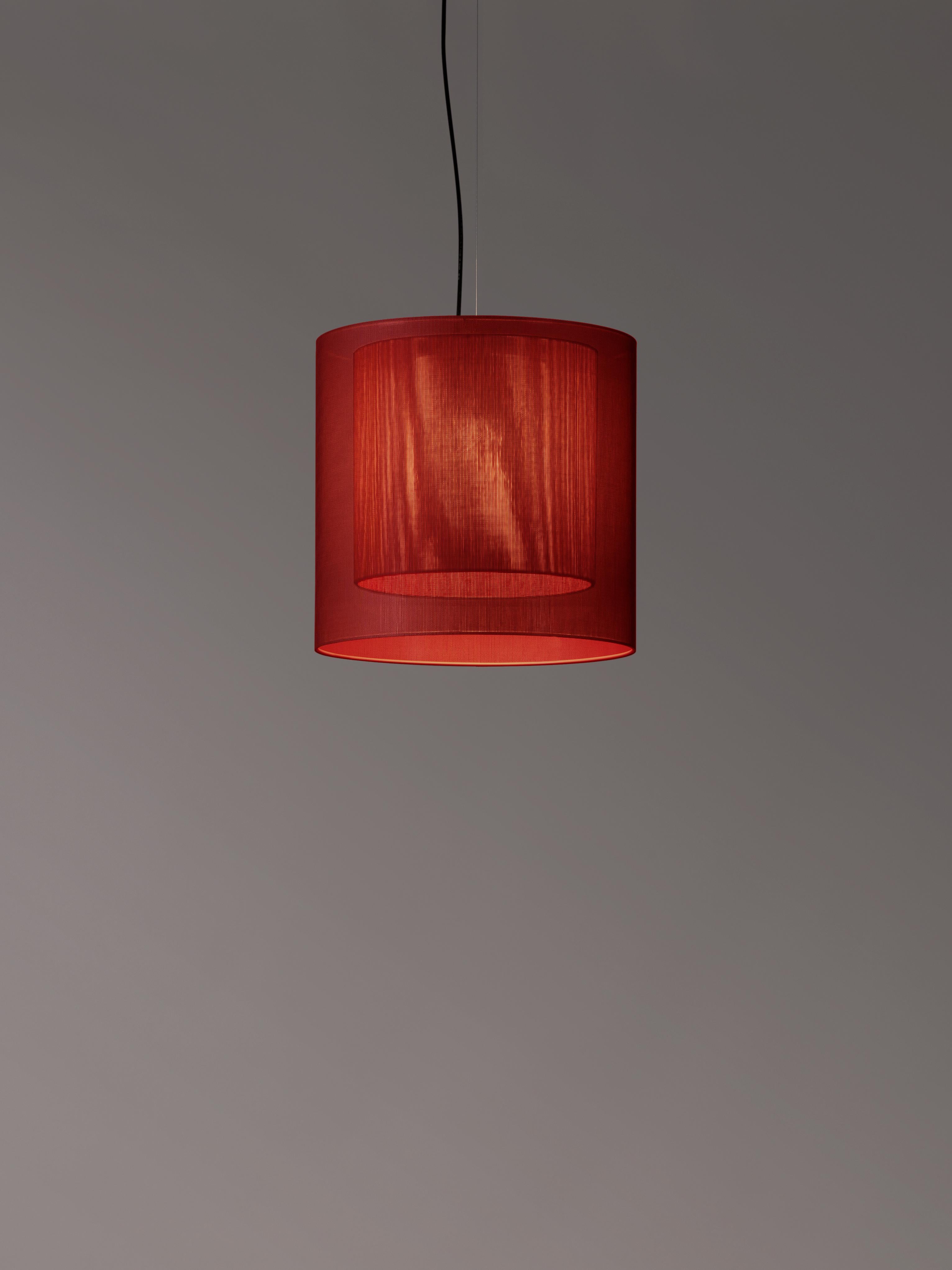 Red Moaré MS pendant lamp by Antoni Arola
Dimensions: D 46 x H 45 cm
Materials: Metal, polyester.
Available in other colors and sizes.

Moaré’s multiple combinations of formats and colours make it highly versatile. The series takes its name
