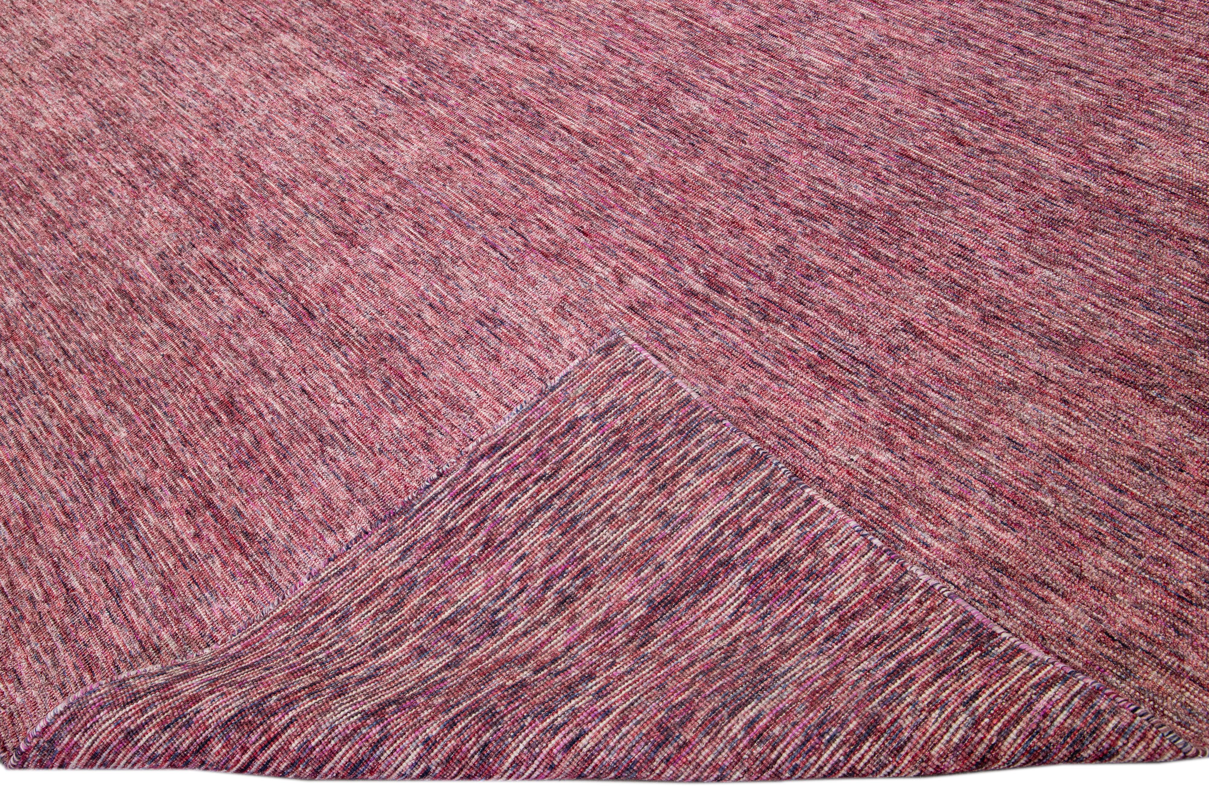 Beautiful Apadanas's handmade bamboo & silk Indian groove rug with the red field. This groove collection rug has an all-over solid design.

This rug measures: 12' x 15'.

Custom colors and sizes are available upon request.

