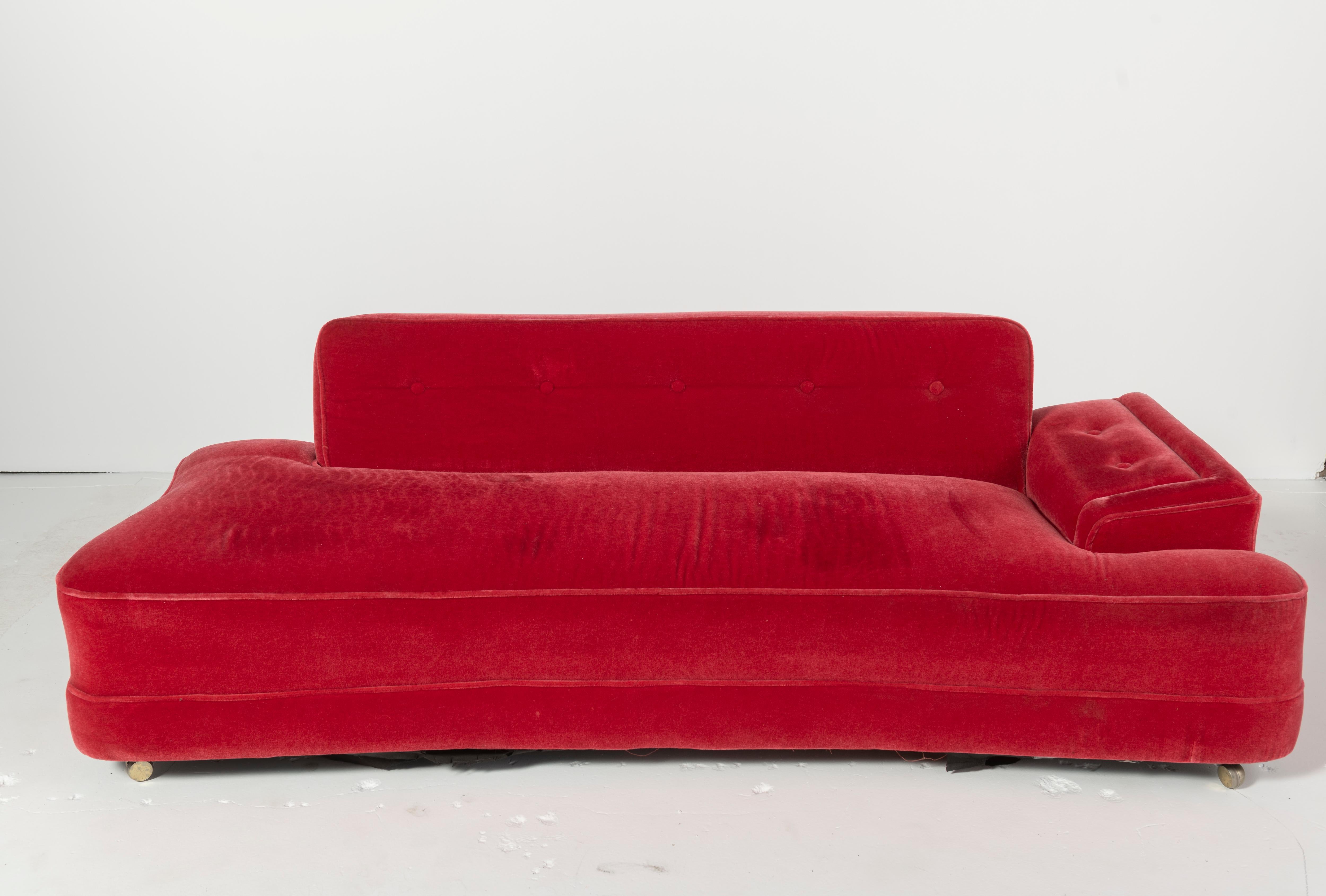 Dramatic mid-century red mohair sofa that converts to a daybed in a great size. Asymmetric with dog-bone shape, a popular style in the 1950s.