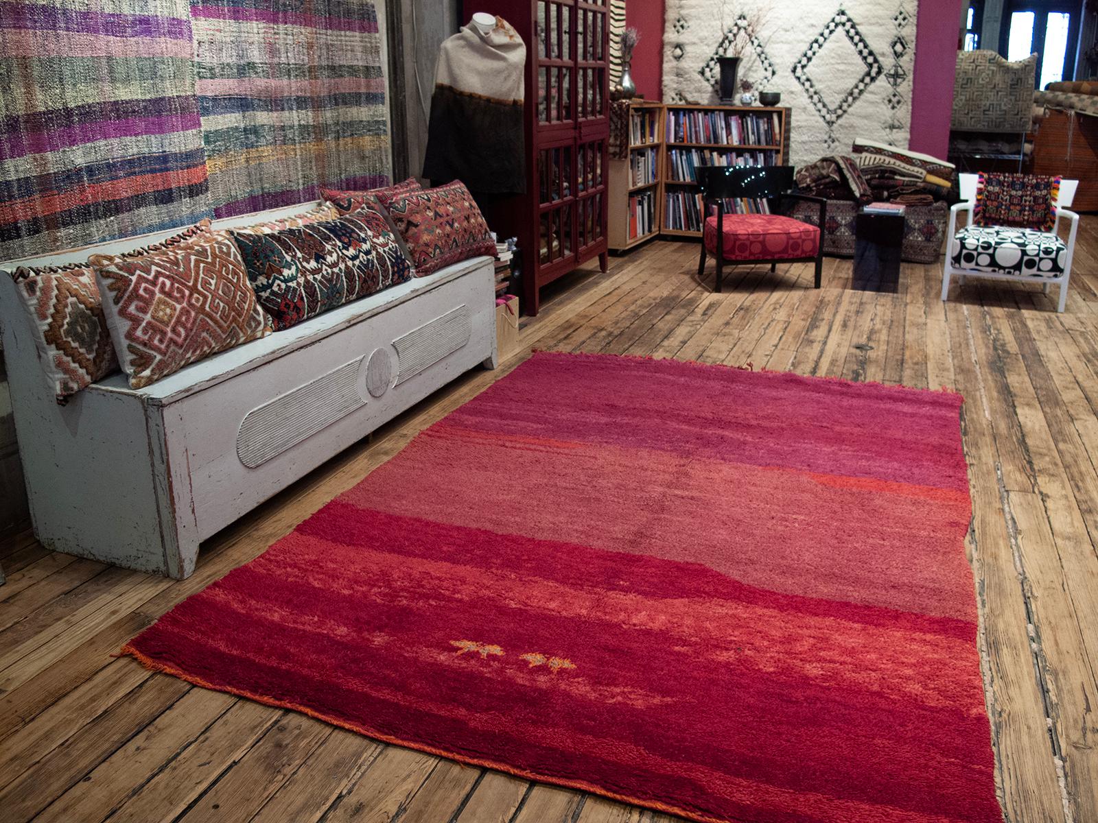 A great example showing how the accidental color shifts, called <i>“abrash”</i> in rug trade, can enhance a seemingly monochromatic rug. Note the two half-finished star or flower motifs at the bottom - the weaver must have had a change of