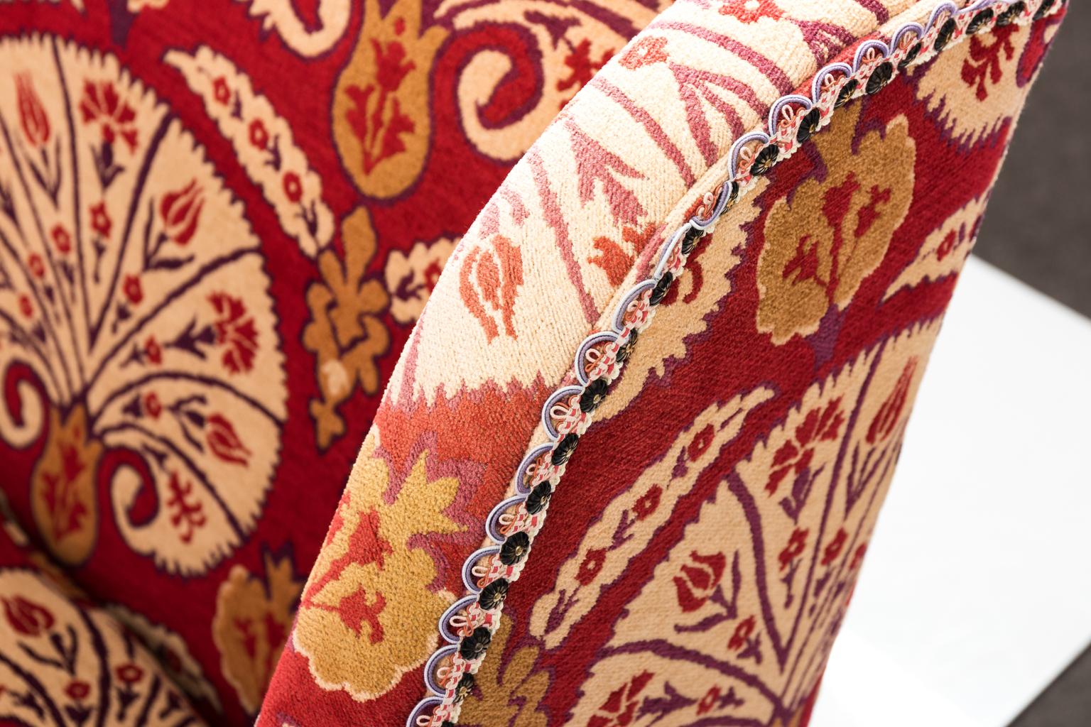 Jacobean oak settee upholstered in textured red Moroccan style Chenille upholstery. The piece includes seven large pillows, brass nail head trim, ring turned stretcher, and block feet, circa 1980s.
 