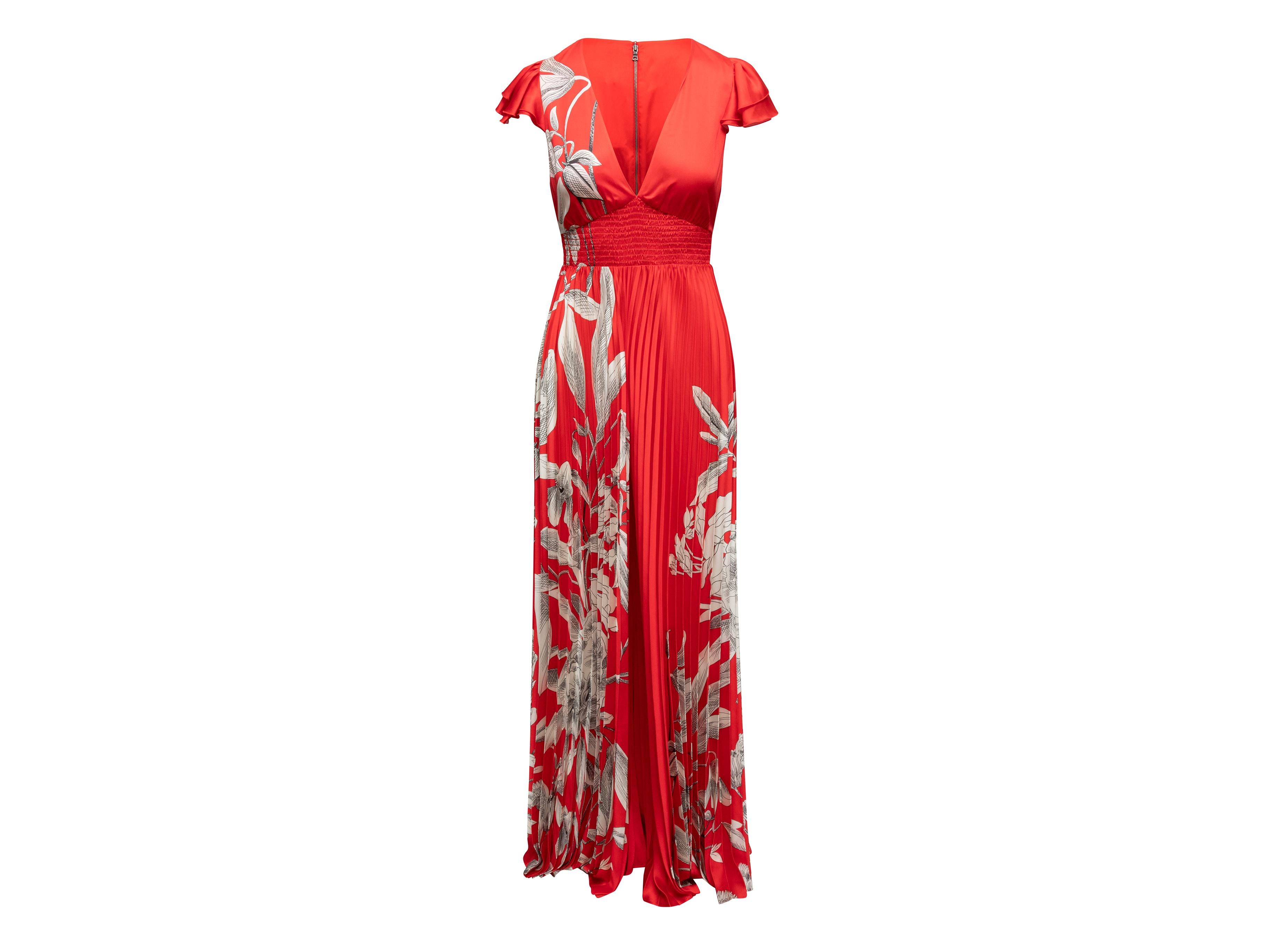 Rot-weiß-schwarzer Jumpsuit mit geblümten Cap-Ärmeln von Alice + Olivia. V-Ausschnitt. Gefaltete Hosenbeine. Reißverschluss in der hinteren Mitte. 28