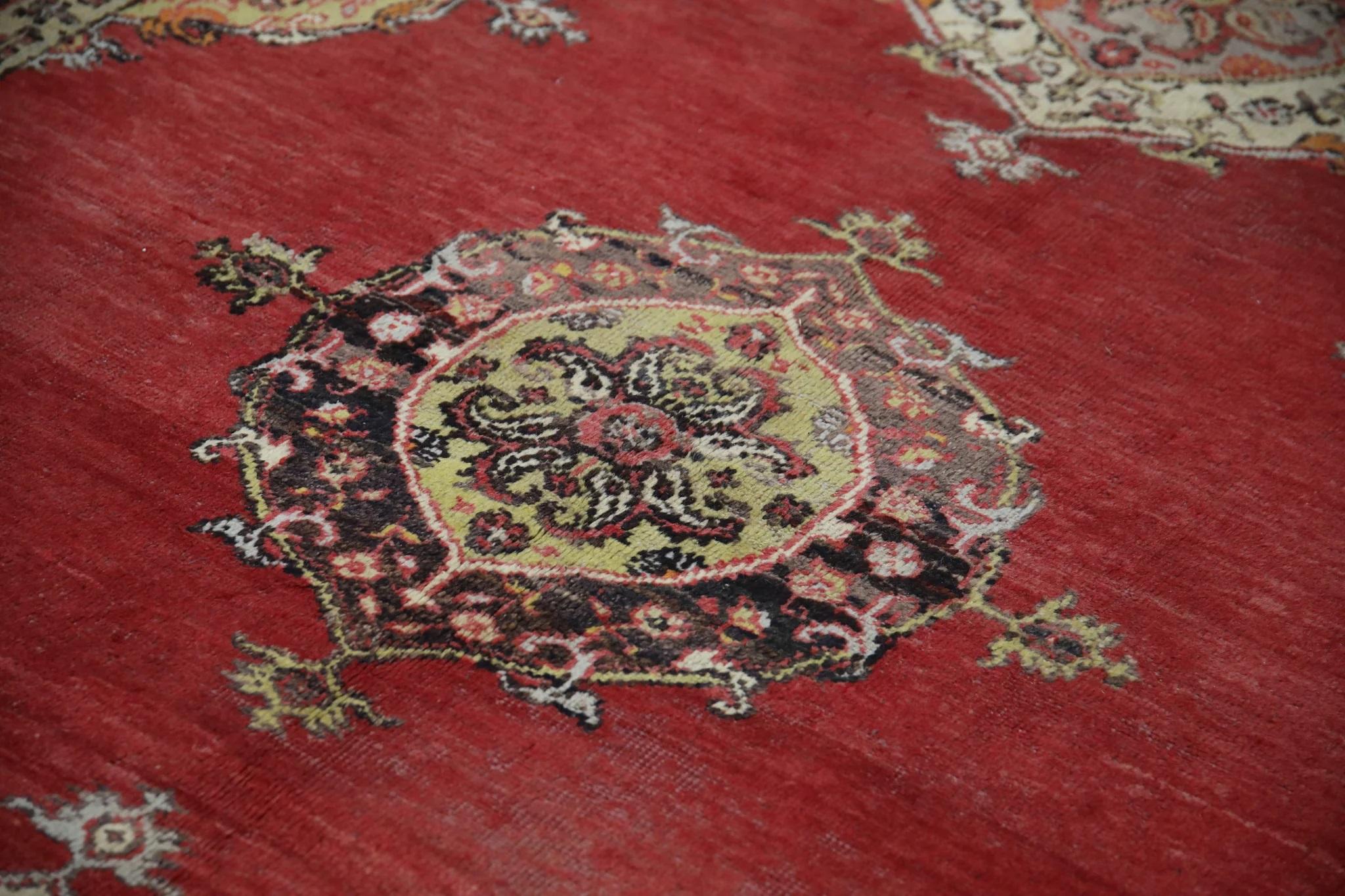 Introducing a one-of-a-kind vintage Turkish hand-knotted wool rug, carefully crafted by skilled artisans using traditional techniques passed down through generations. This exquisite rug boasts a stunning array of natural dyes, resulting in a rich