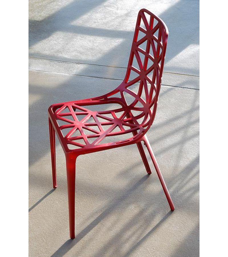 Red new Eiffel Tower chair by Alain Moatti
Materials: Structure in epoxy lacquered cast aluminum (suitable for outdoor and indoor)
Dimensions: D 41 x W 44 x H 88 cm
Available colors: Eiffel Tower, black, white, or aluminum, and red (indoor