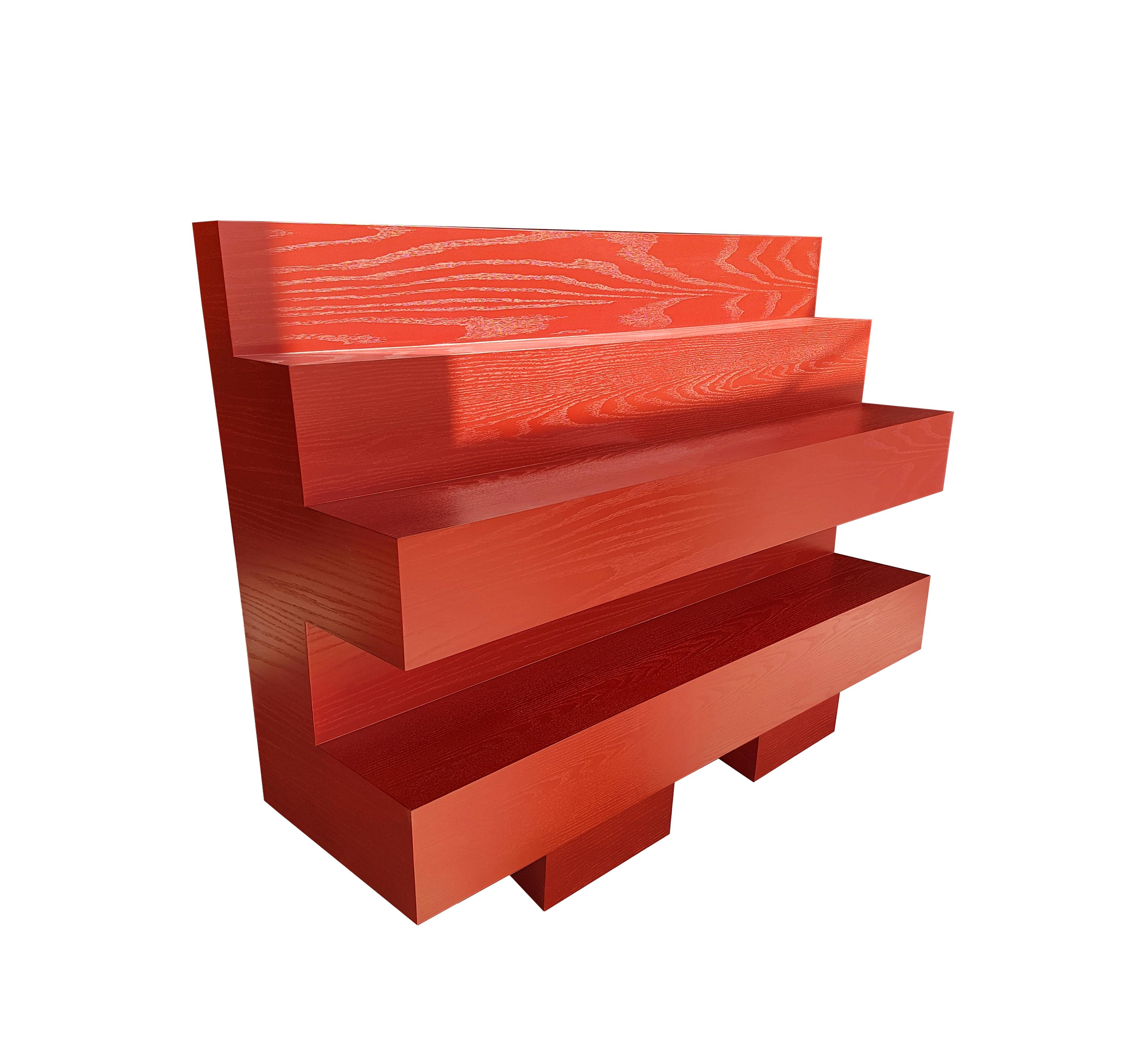 Dark pastel Red to accommodate a robust personal library. This piece with an extended lines and layered step design will give you the freedom to align your book. Part of (the topography of our intimate being).
It has a very smooth finish which