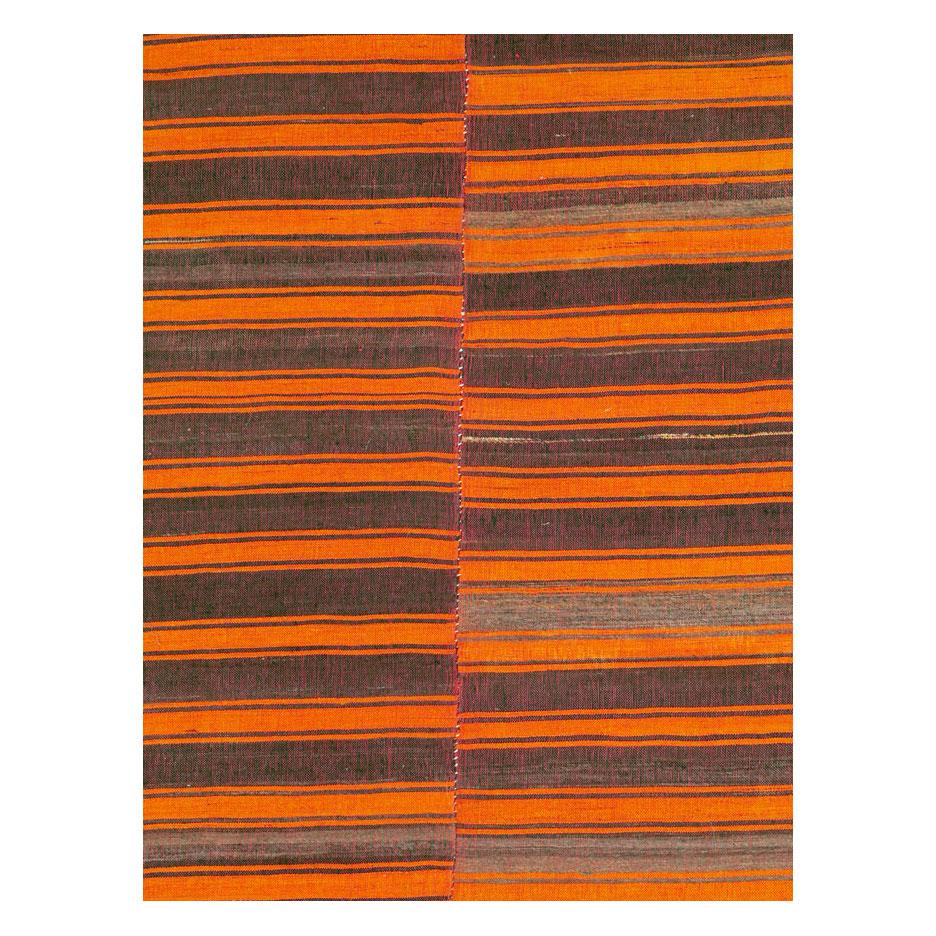 A vintage Turkish flat-weave Kilim square room size rug handmade during the mid-20th century with an asymmetrical horizontally striped pattern in shades of red-orange and aubergine/eggplant (purple).

Measures: 8' 4