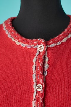 Red-orangy cashmere cardigan with branded buttons Chanel