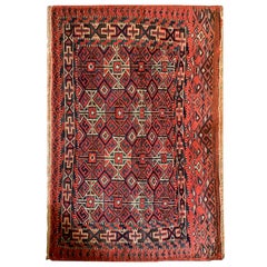 Tappeto antico orientale rosso, tappeto turkmeno in lana geometrica