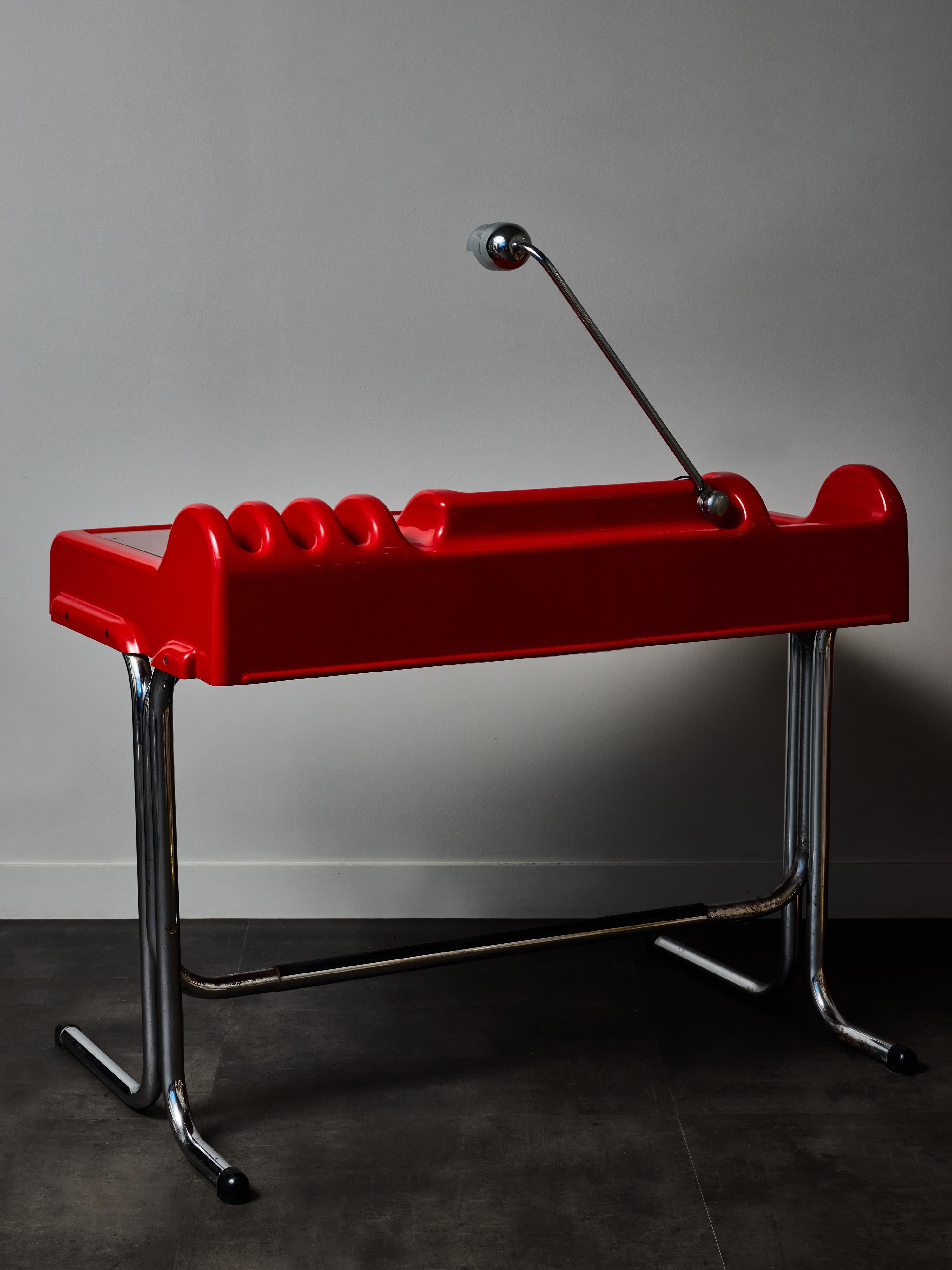 Striking example of Italian Radical design, this red “Orix” desk was created by architects Vittorio Parigi and Nani Prina for Molteni in the early 1970s. Bold, sculptural, and unmistakably futuristic, the Orix desk reflects the experimental spirit
