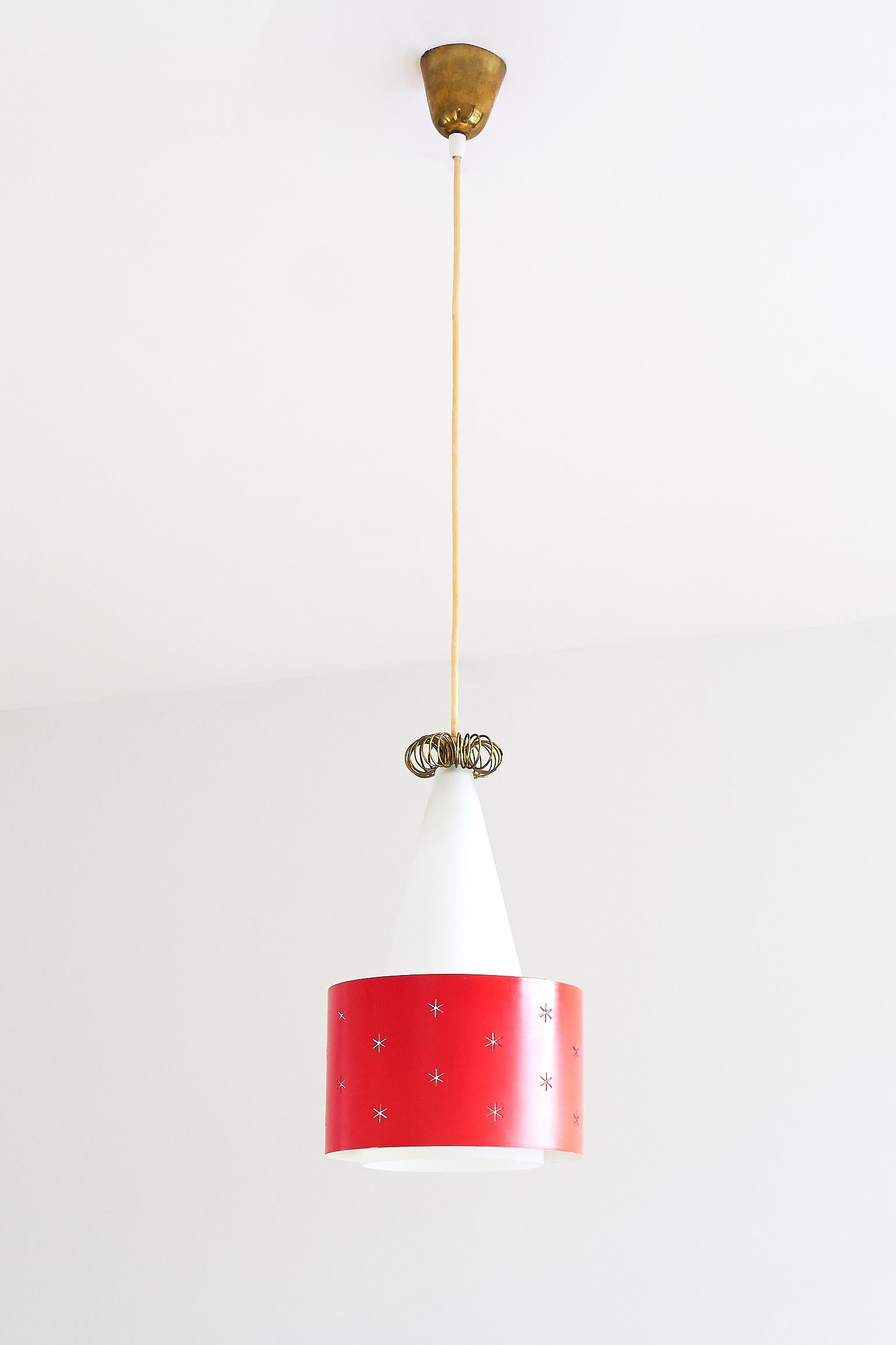 A rare red pendant designed by Paavo Tynell and produced by Idman in 1955. The model number is K2-10/ N-9241. The conical shade is made of a white matte glass, resulting in a soft and diffused light. The red painted metal ring appears to float
