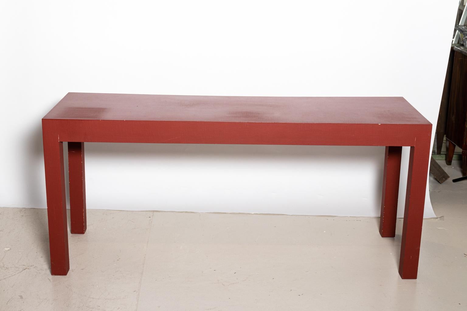 Red painted console with two drawers by Minic Custom Woodwork. Please note of wear consistent with age including chips and paint loss as seen on the corners Made in the United States. Maker's plaque featured on the inside of the drawer.