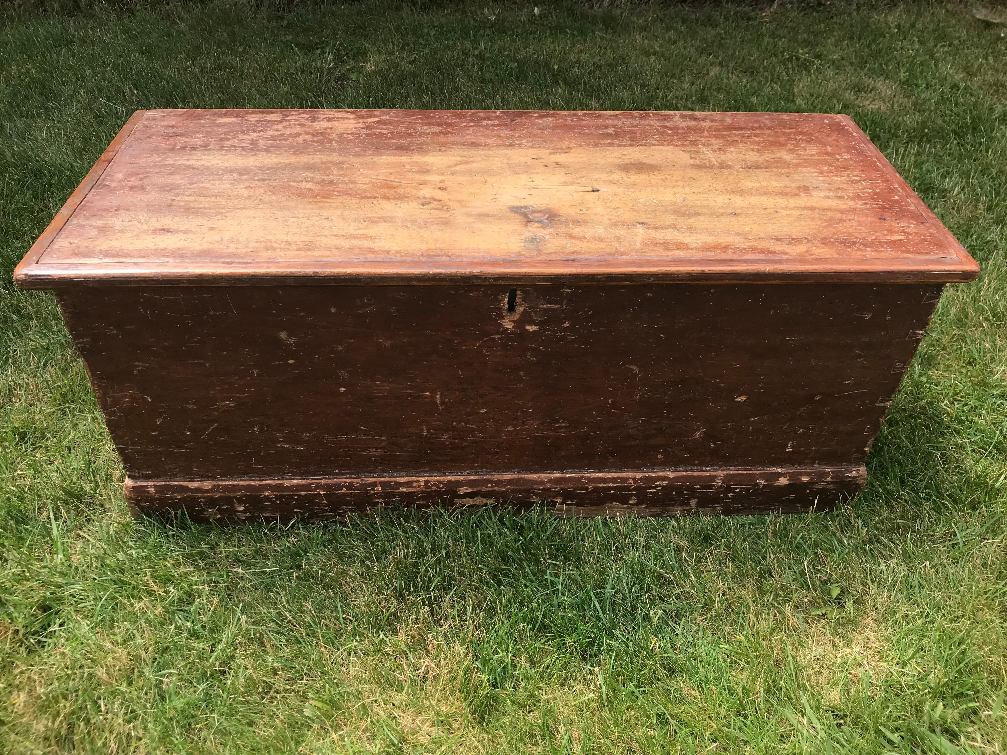 Late 19th century Canadian blanket chest with heart shaped handles in old red paint.