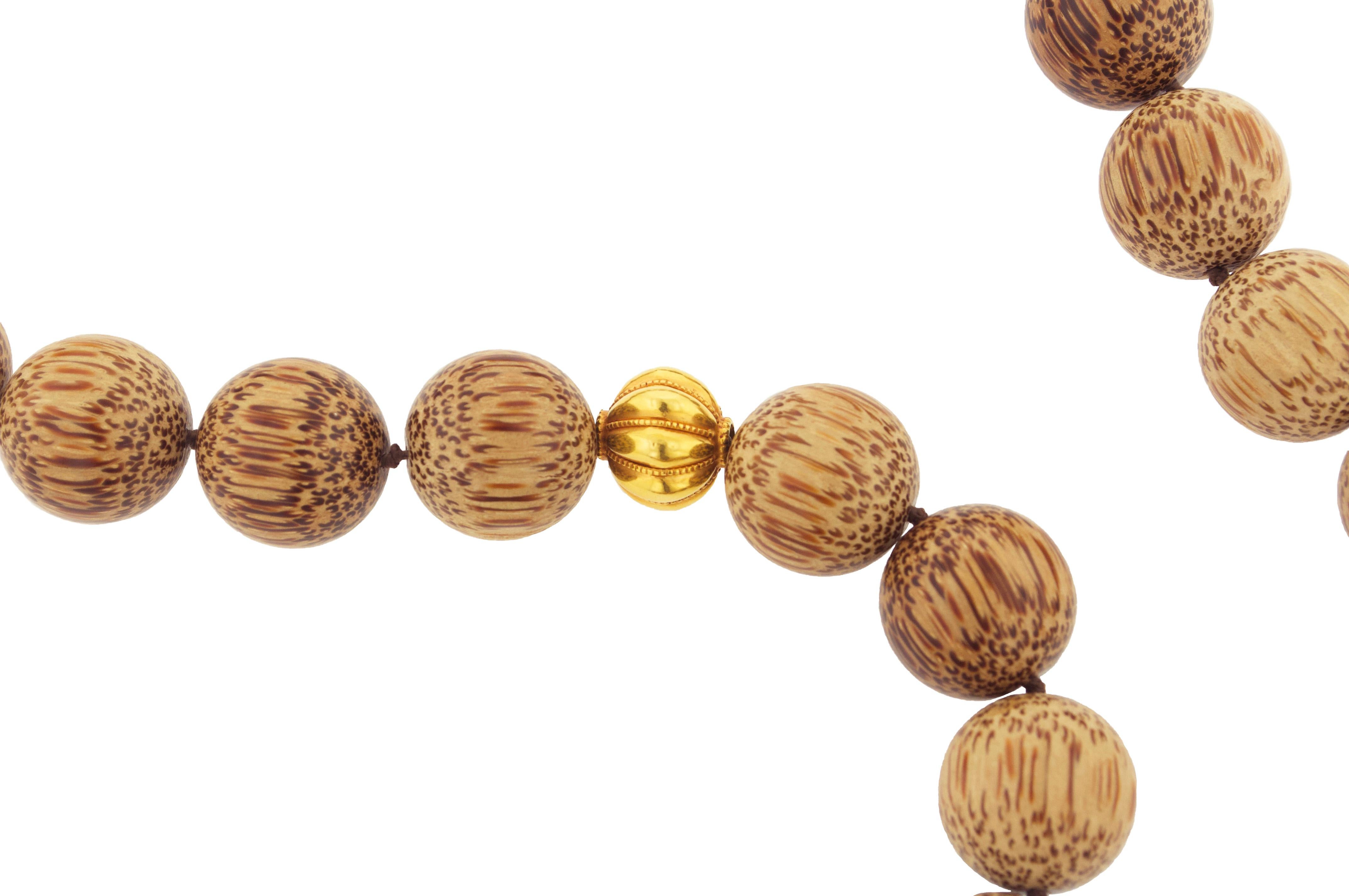 34 Palmwood Beads that each measure 20 mm

6 Gold beads: 22.74 grams

22 karat gold Indian beads

Approx. Length is 30 inches